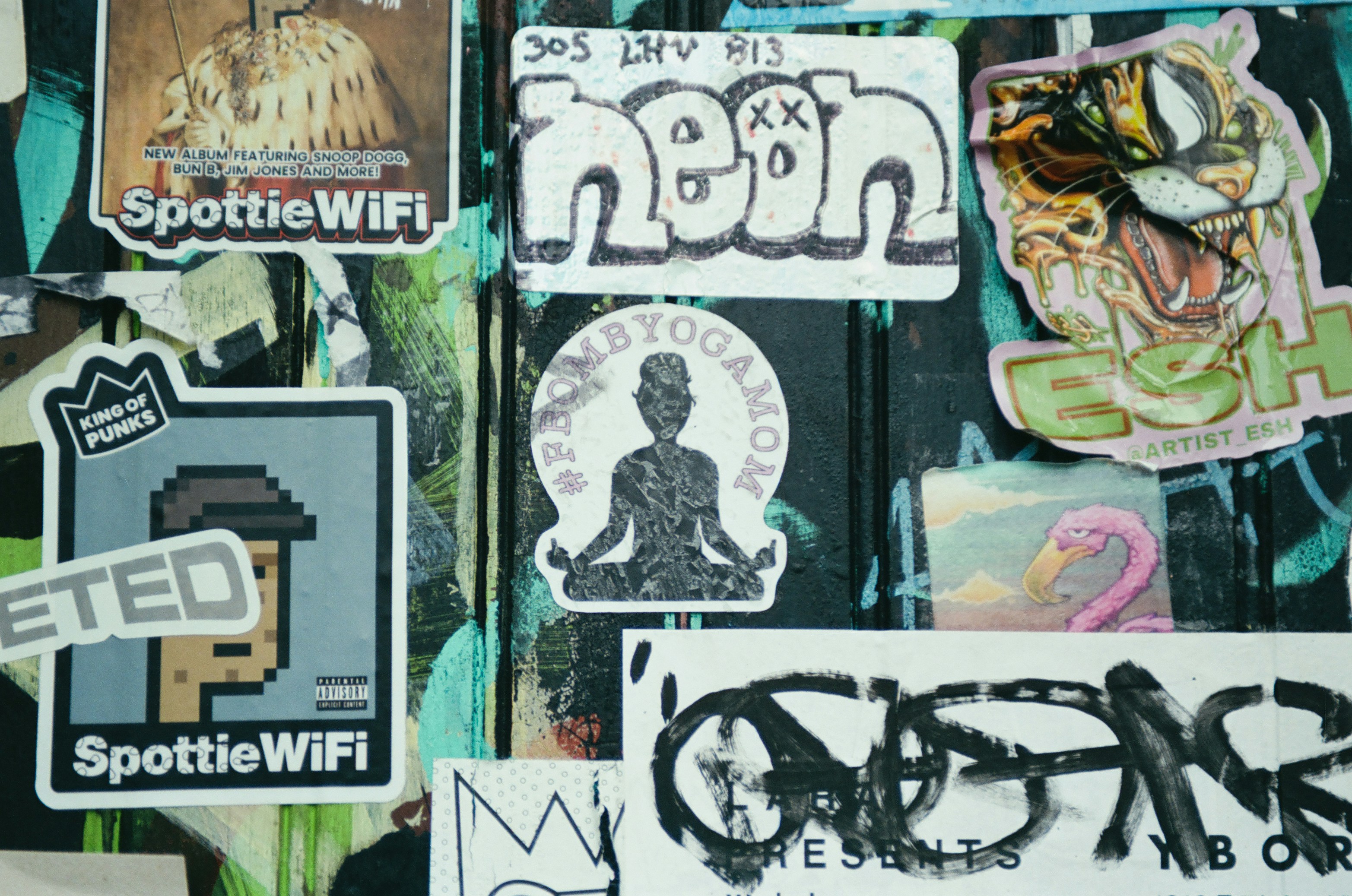 Collage of various stickers and graffiti art.