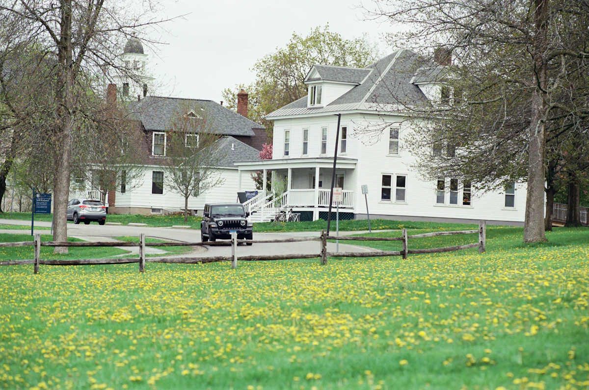 Suburban neighbourhood homes with green lawns in spring