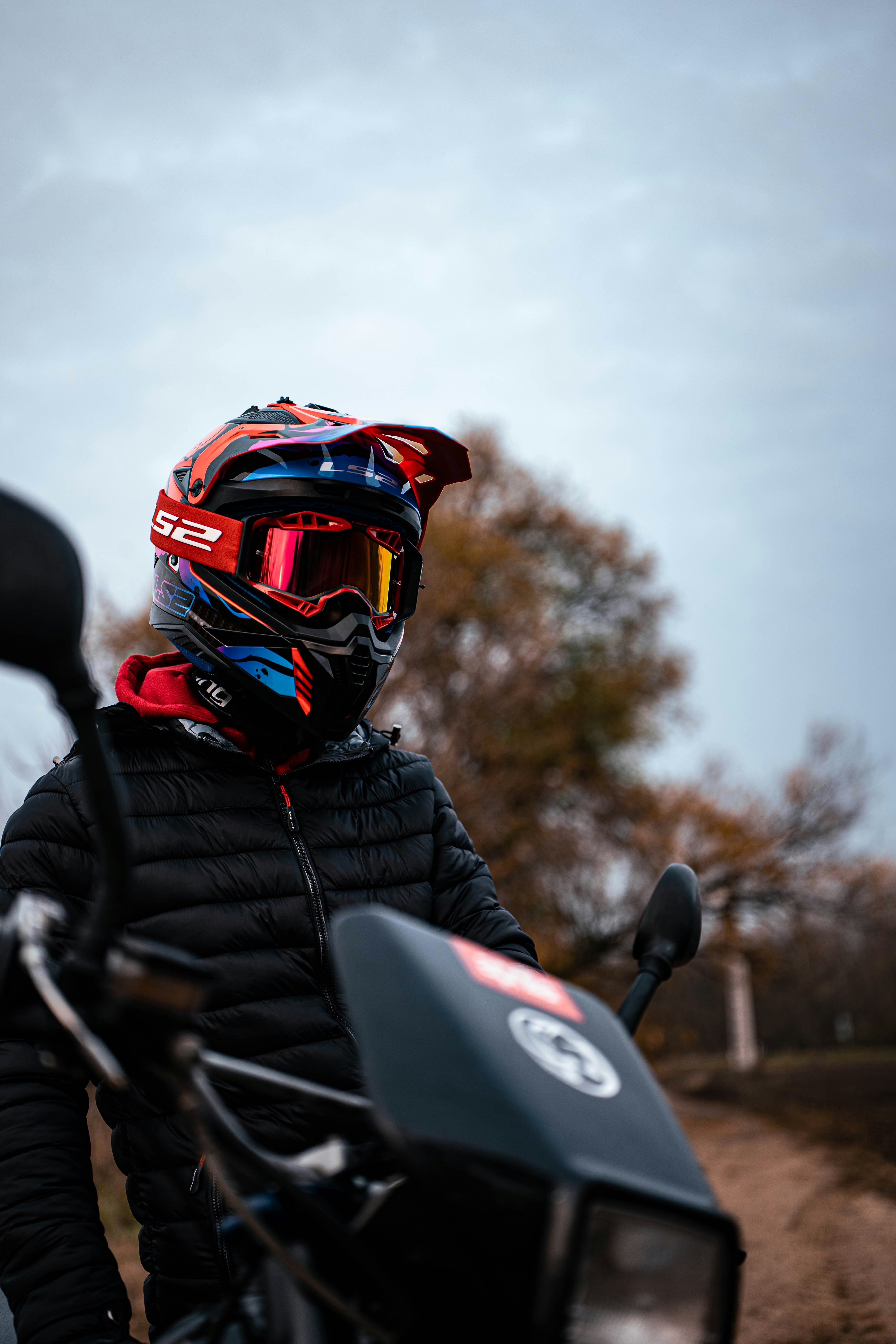 Rider in helmet and goggles on motorcycle