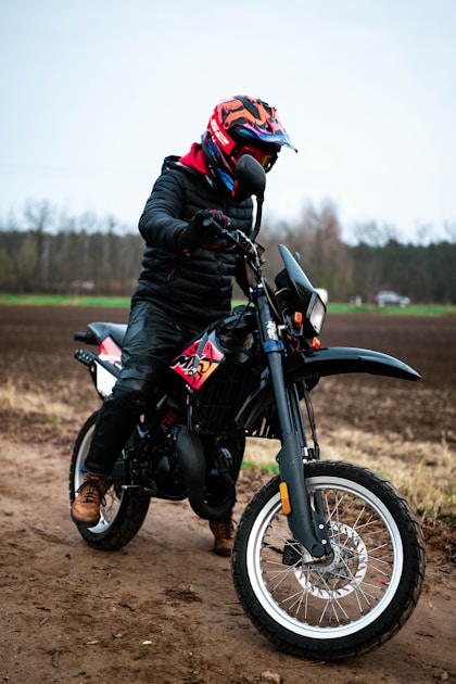 Hunter in full layered hunting clothing system in cold mountain weather at elevation