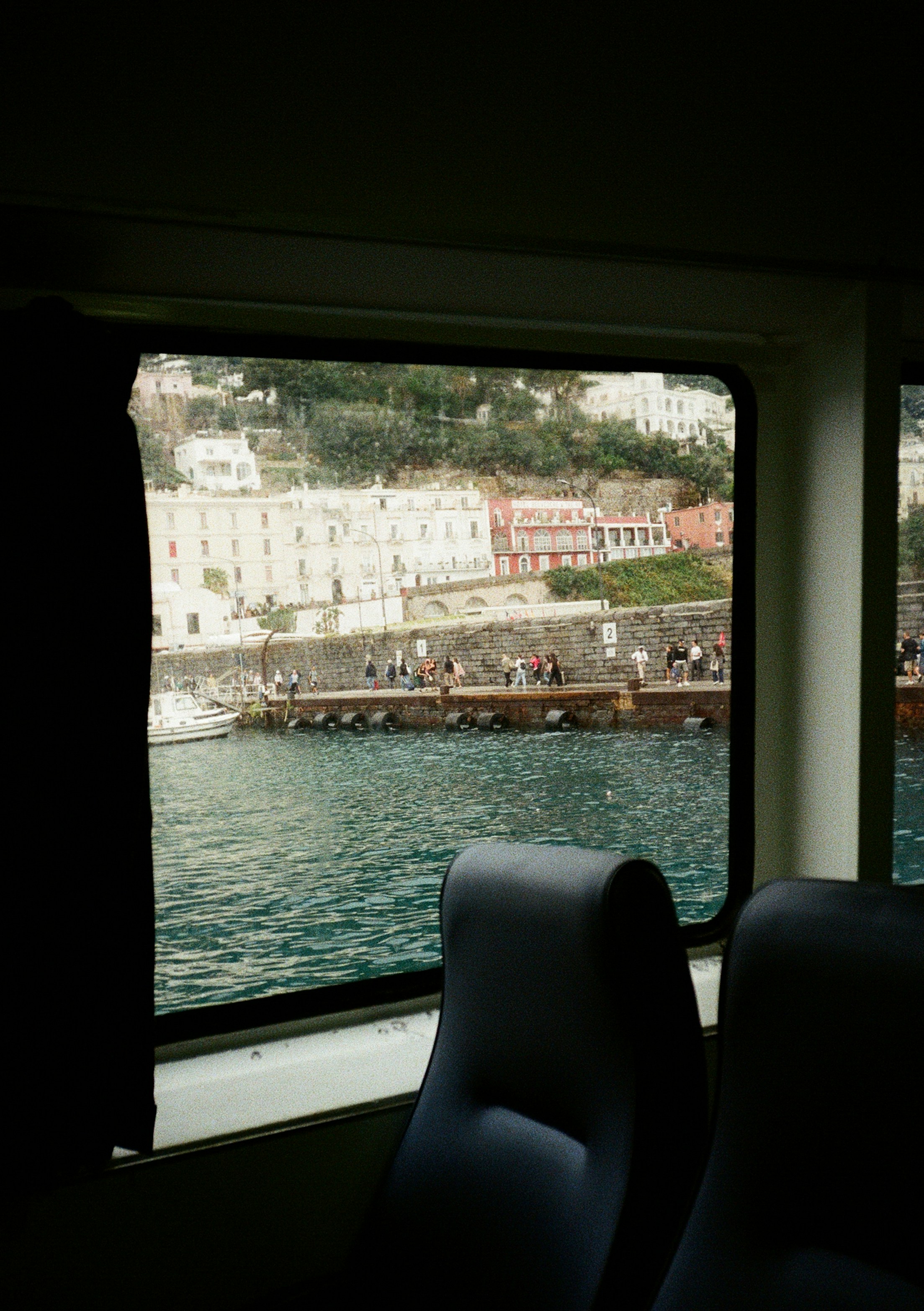 View of a coastal town from a ferry window.