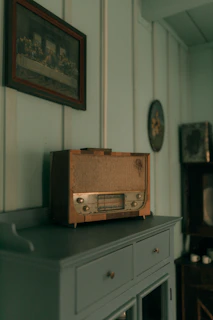 Vintage radio sits on a cabinet