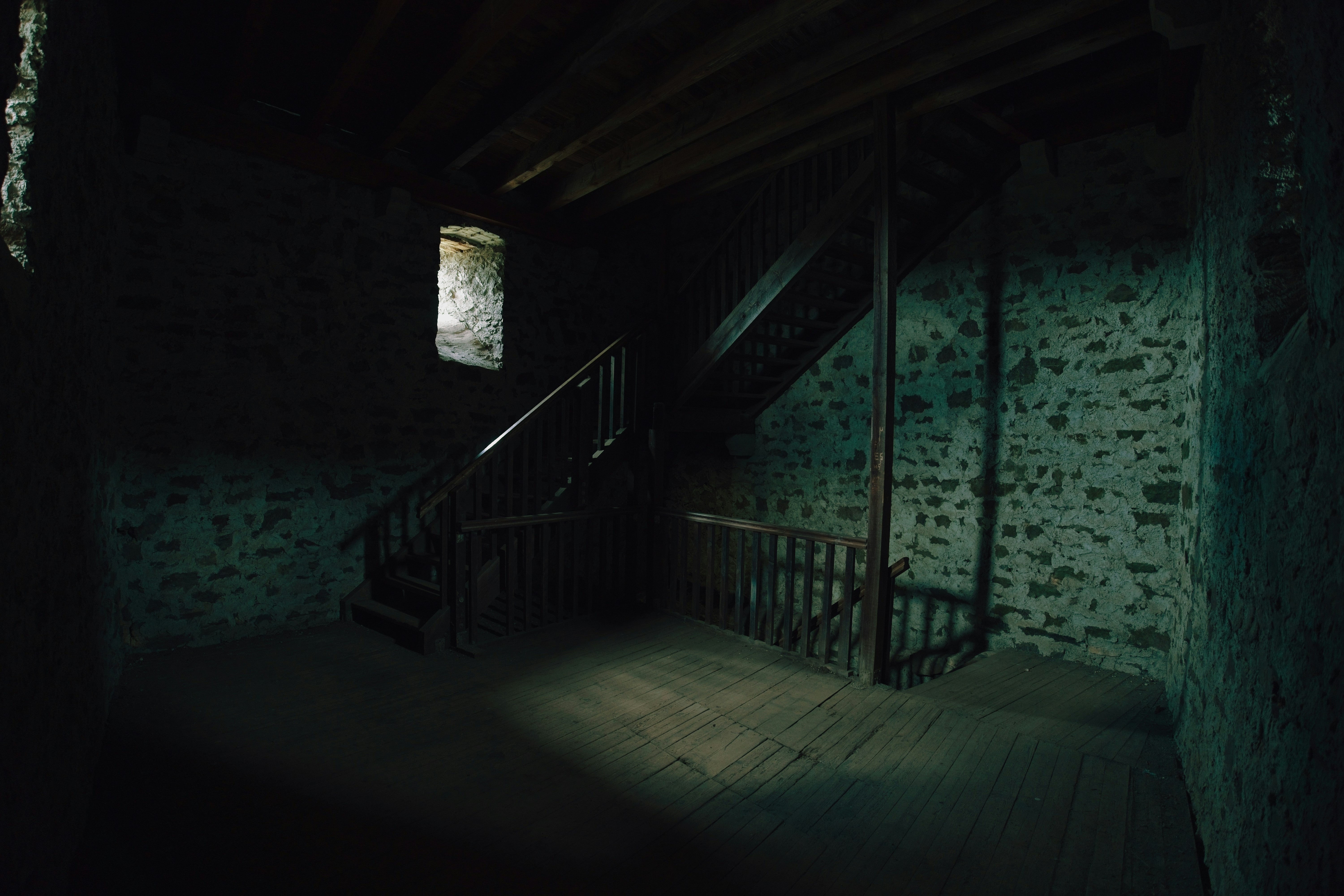 Dark Grey Walls In A Dimly Lit Room With Dust Particles Visible In The Air