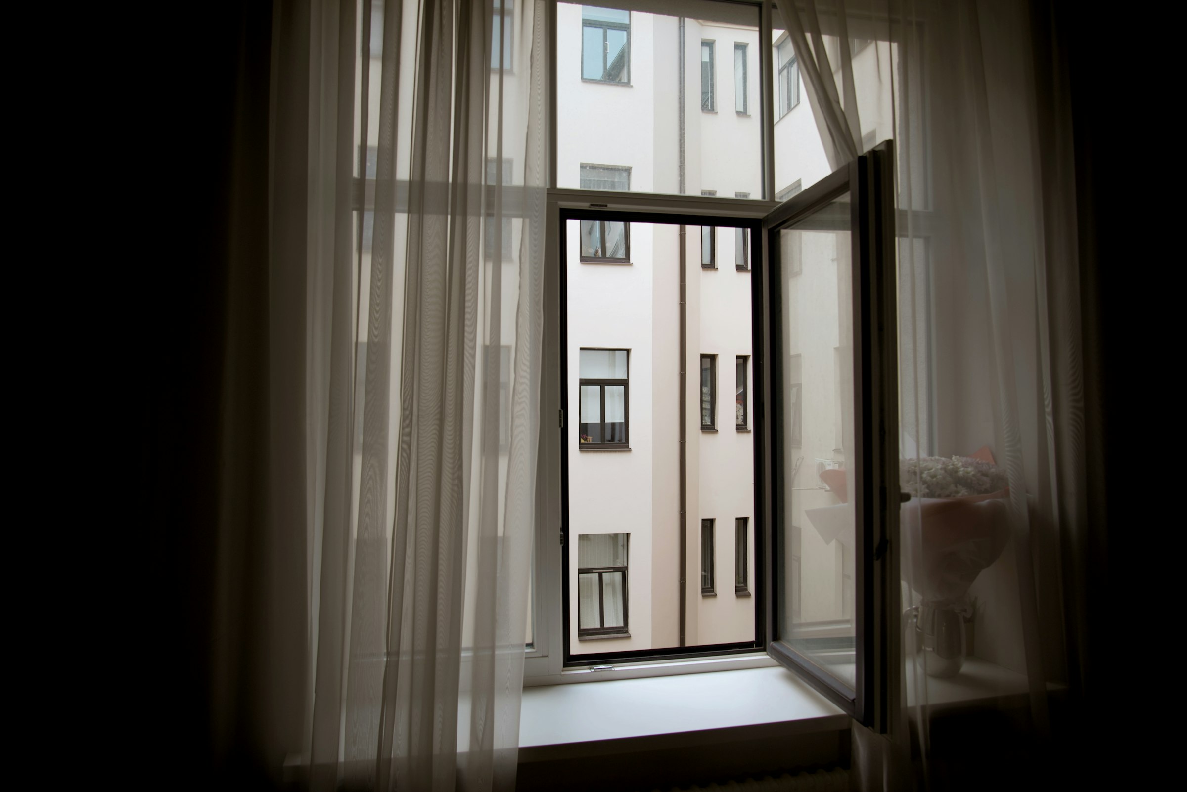 Tilt-and-turn window open inward showing the full swing position