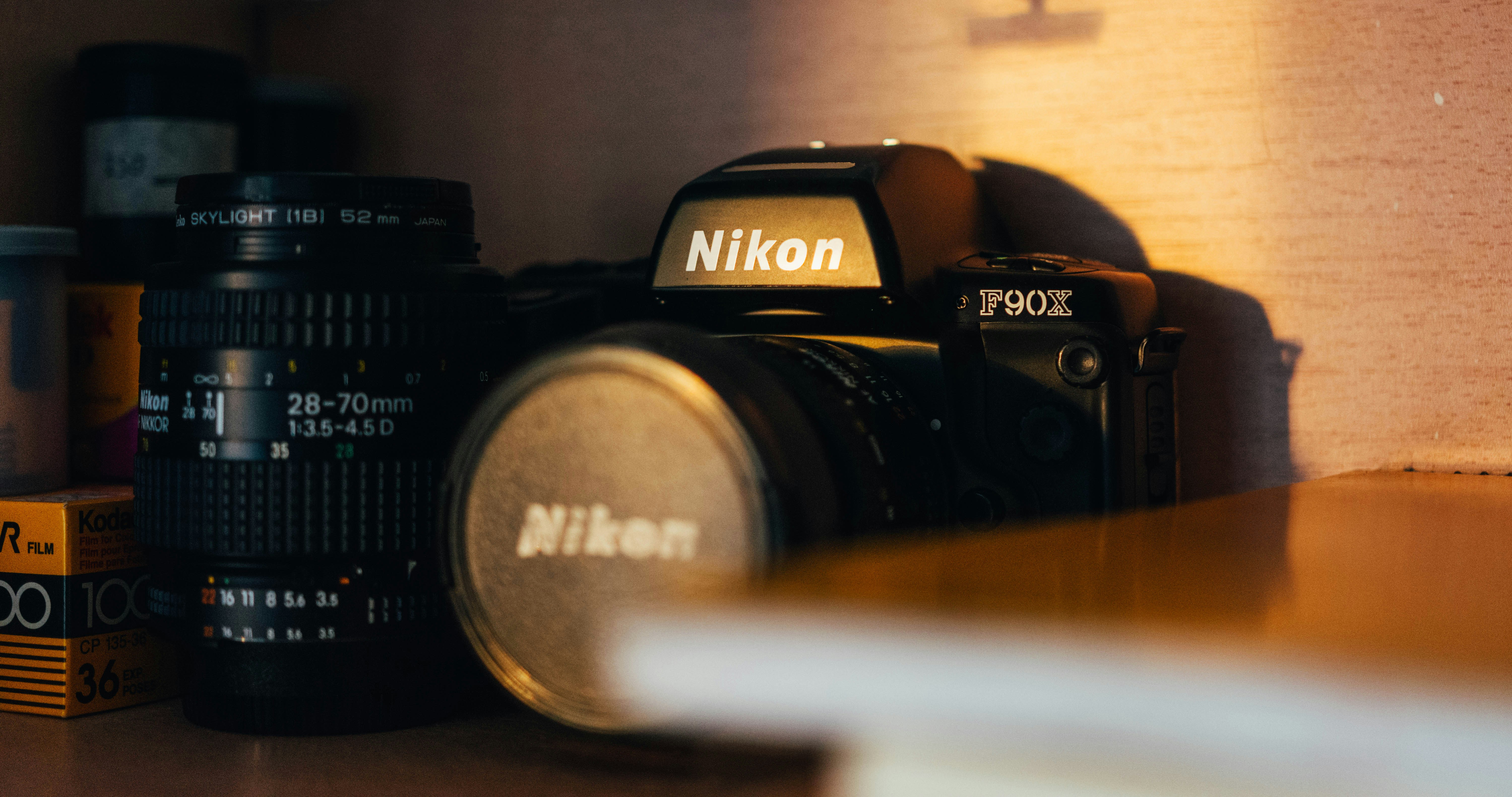 Nikon camera with lens and film canisters