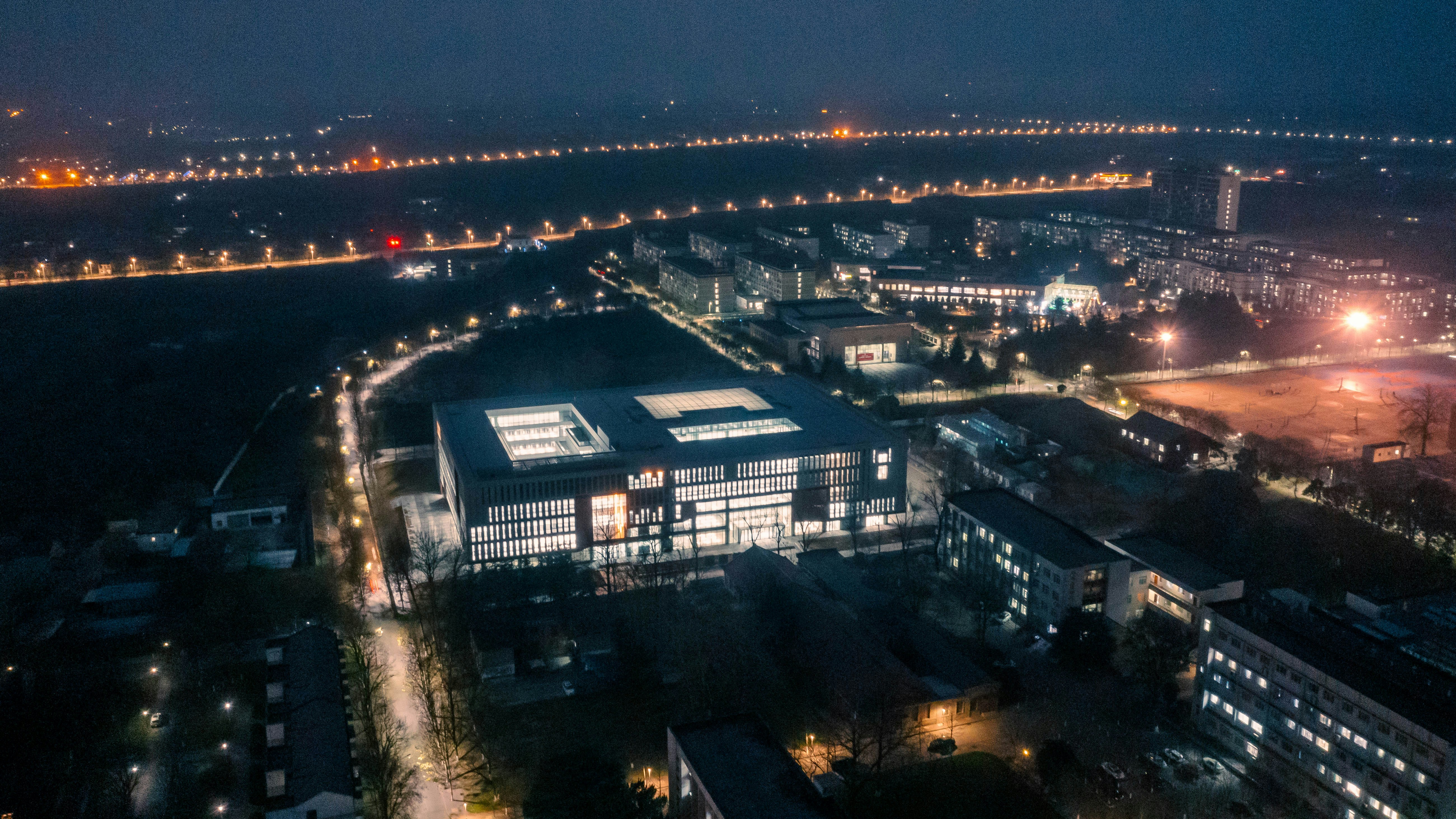 Modern hostel building at night