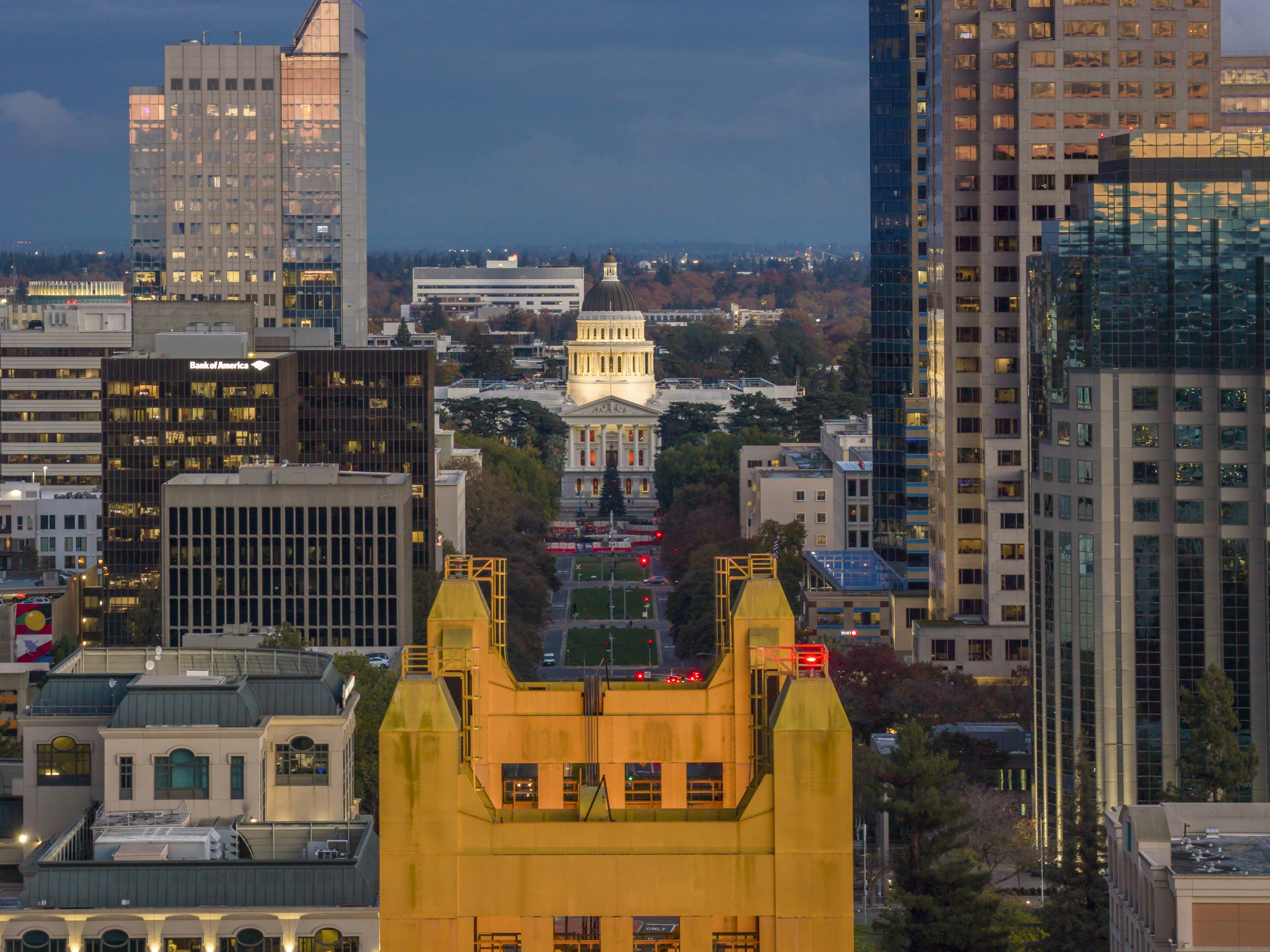 Cityscape with illuminated buildings at dusk