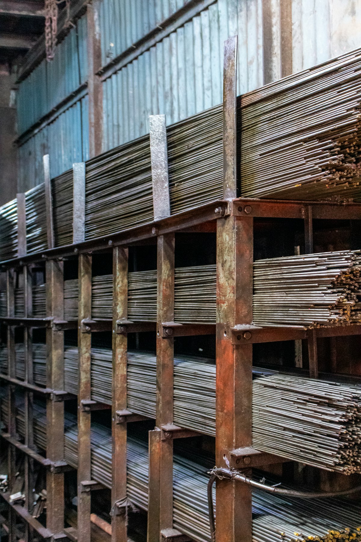 Steel and metal industrial materials in a warehouse representing American manufacturing