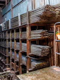 Metal rods stacked in a warehouse storage