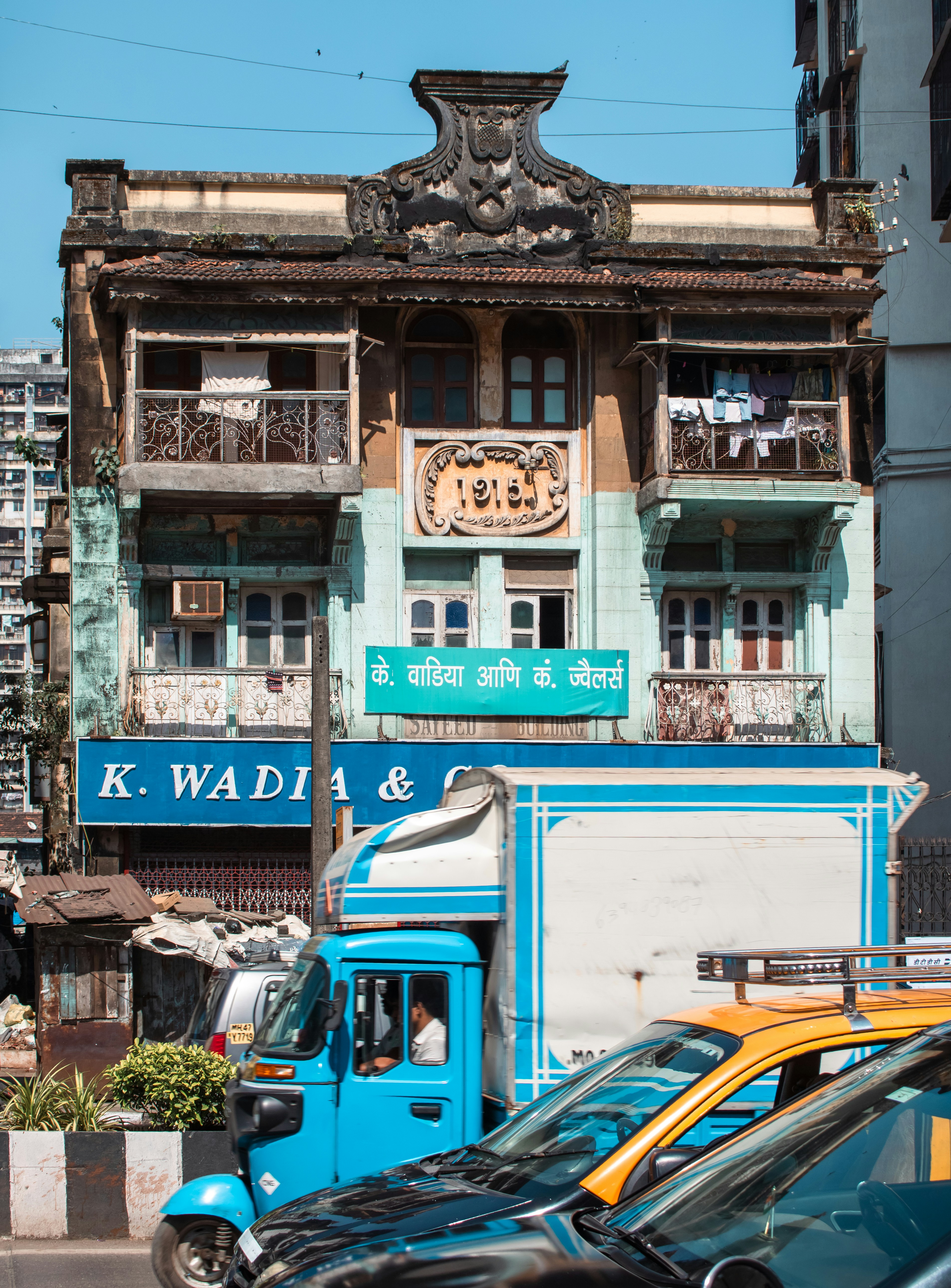 Ornate building facade with blue and teal accents.