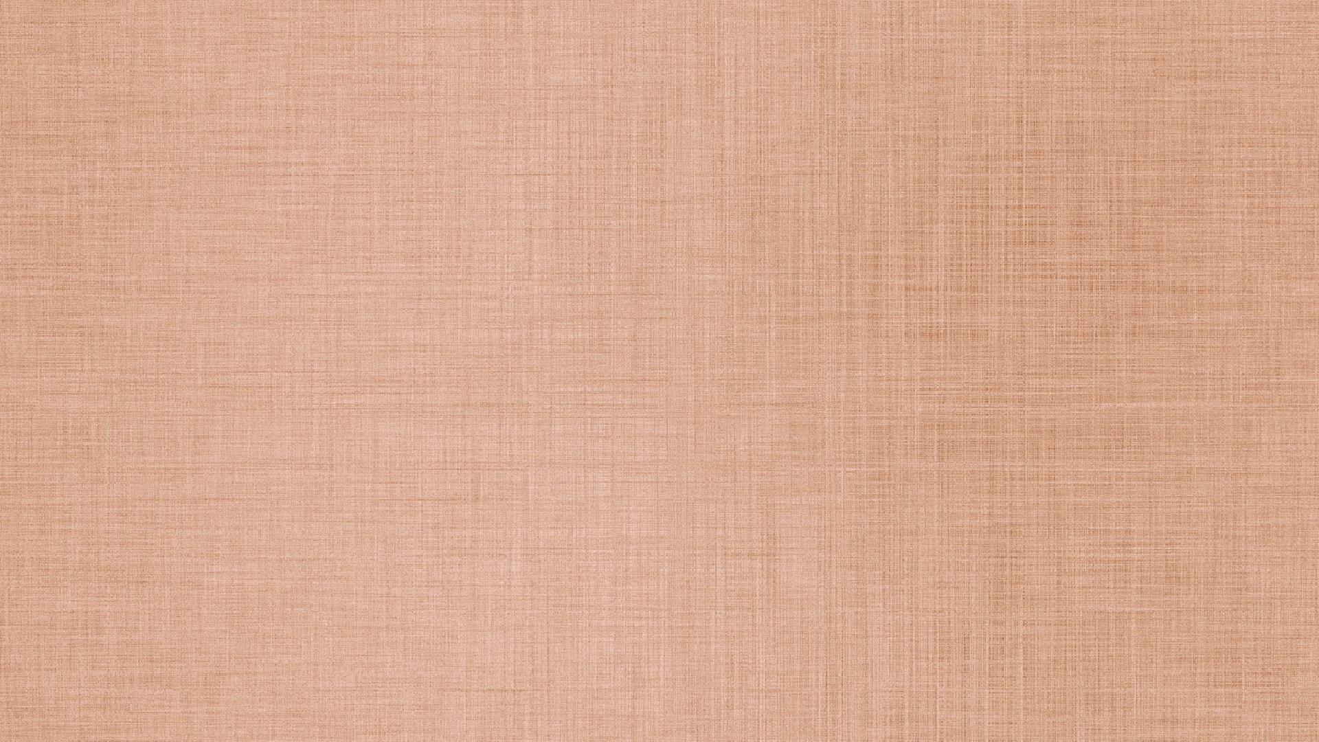 A close-up of a textured peach fabric