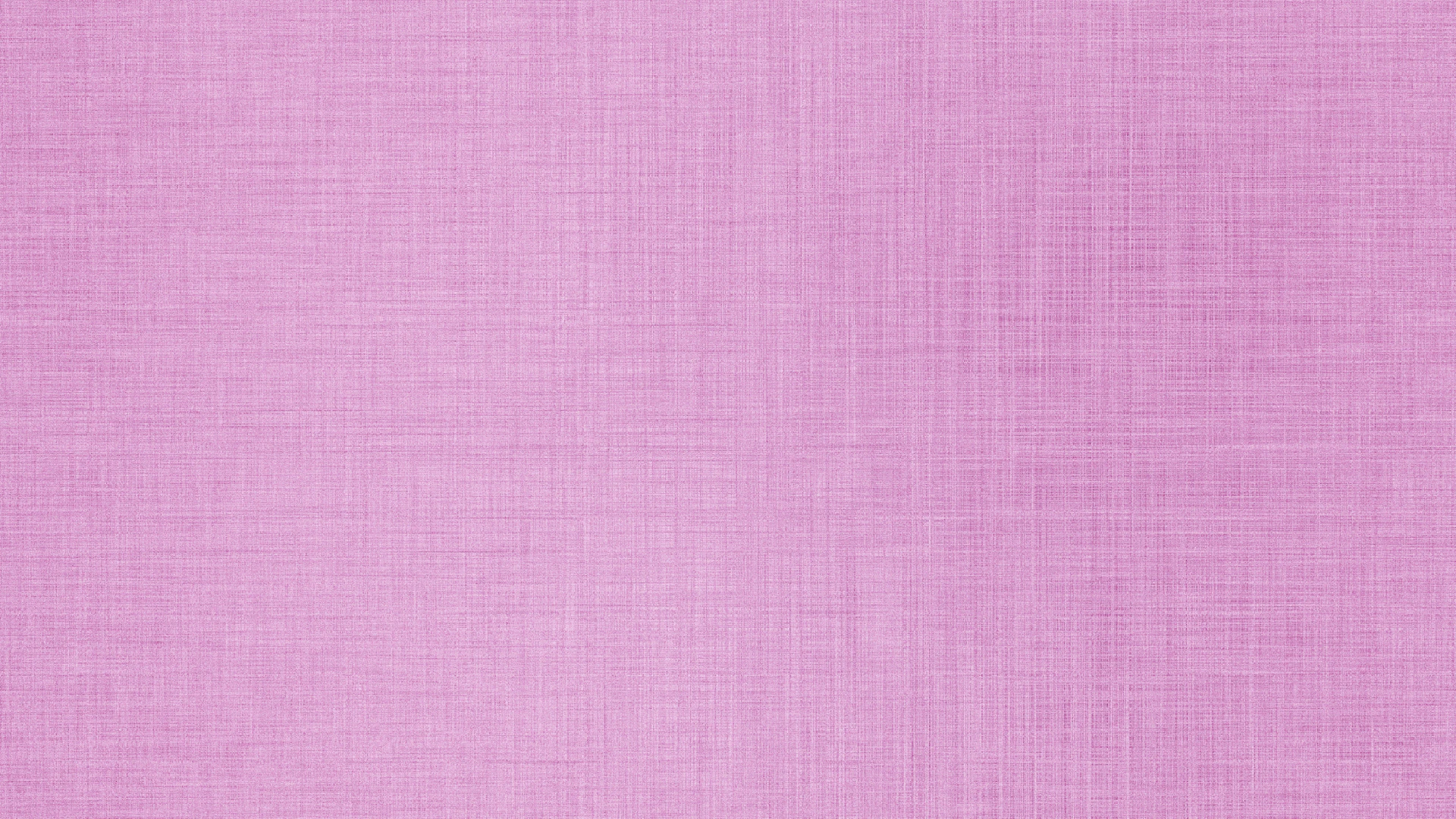 Solid light pink textured fabric background