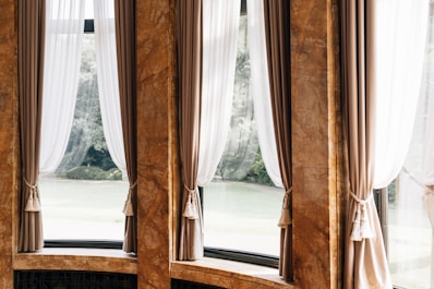 Elegant curtains framing a view of greenery