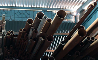 Various metal pipes and tubes stacked together.