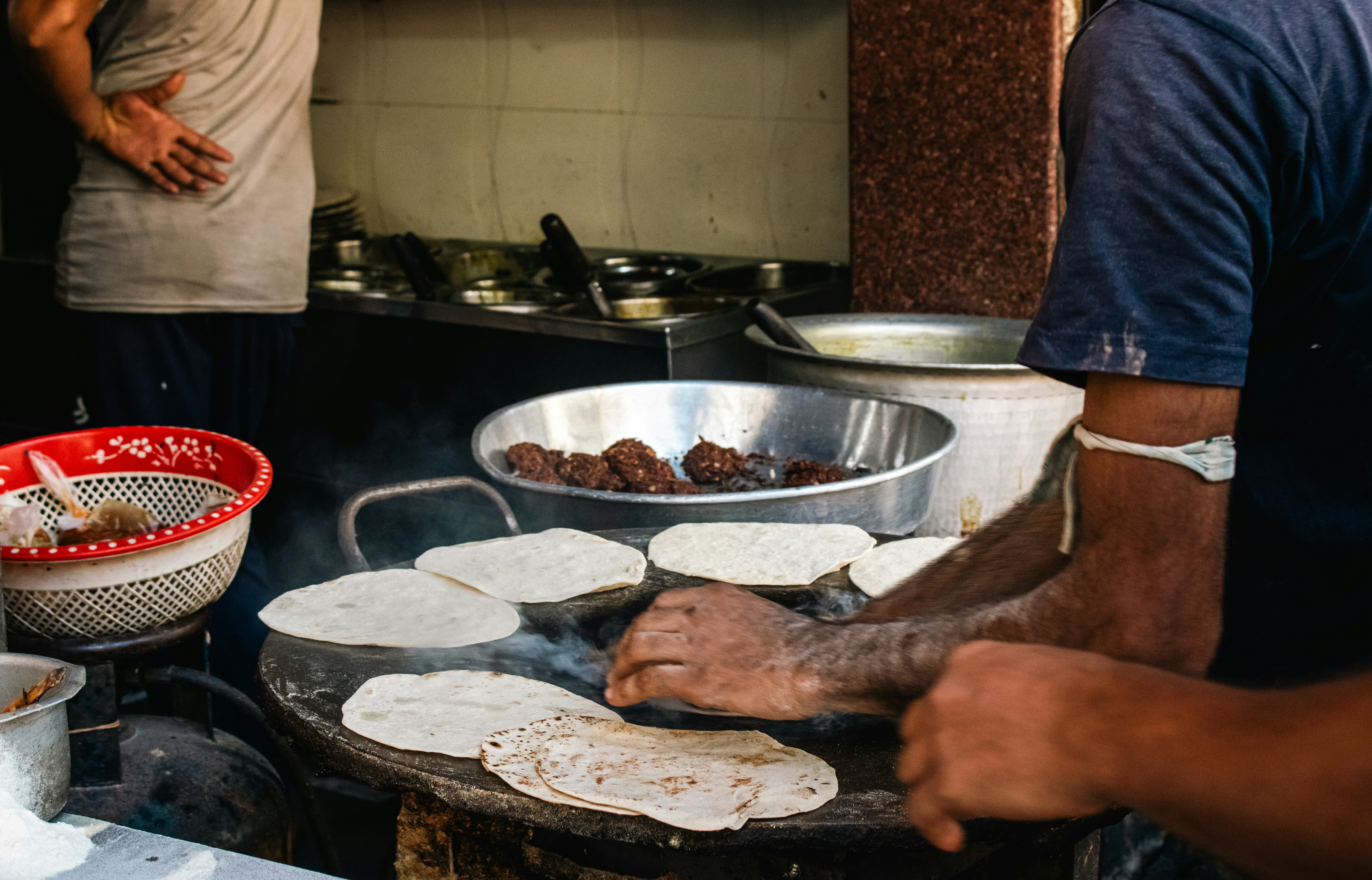 Street vendor preparing flatbread
