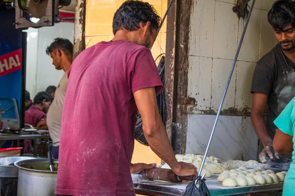 Cooks preparing food in a busy kitchen
