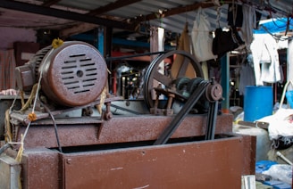 Old industrial machine with motor and pulley system