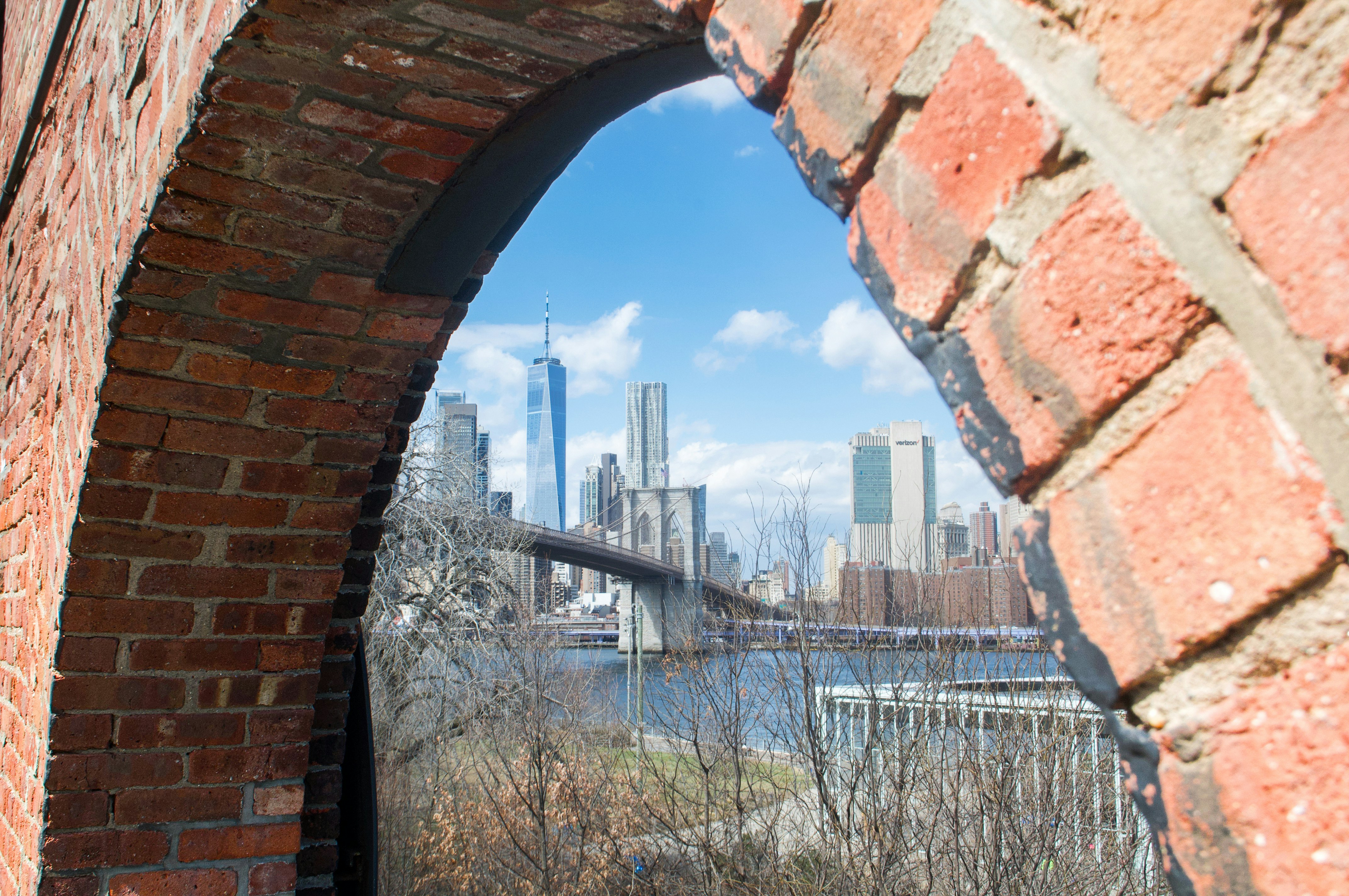 New york city skyline viewed through brick archway