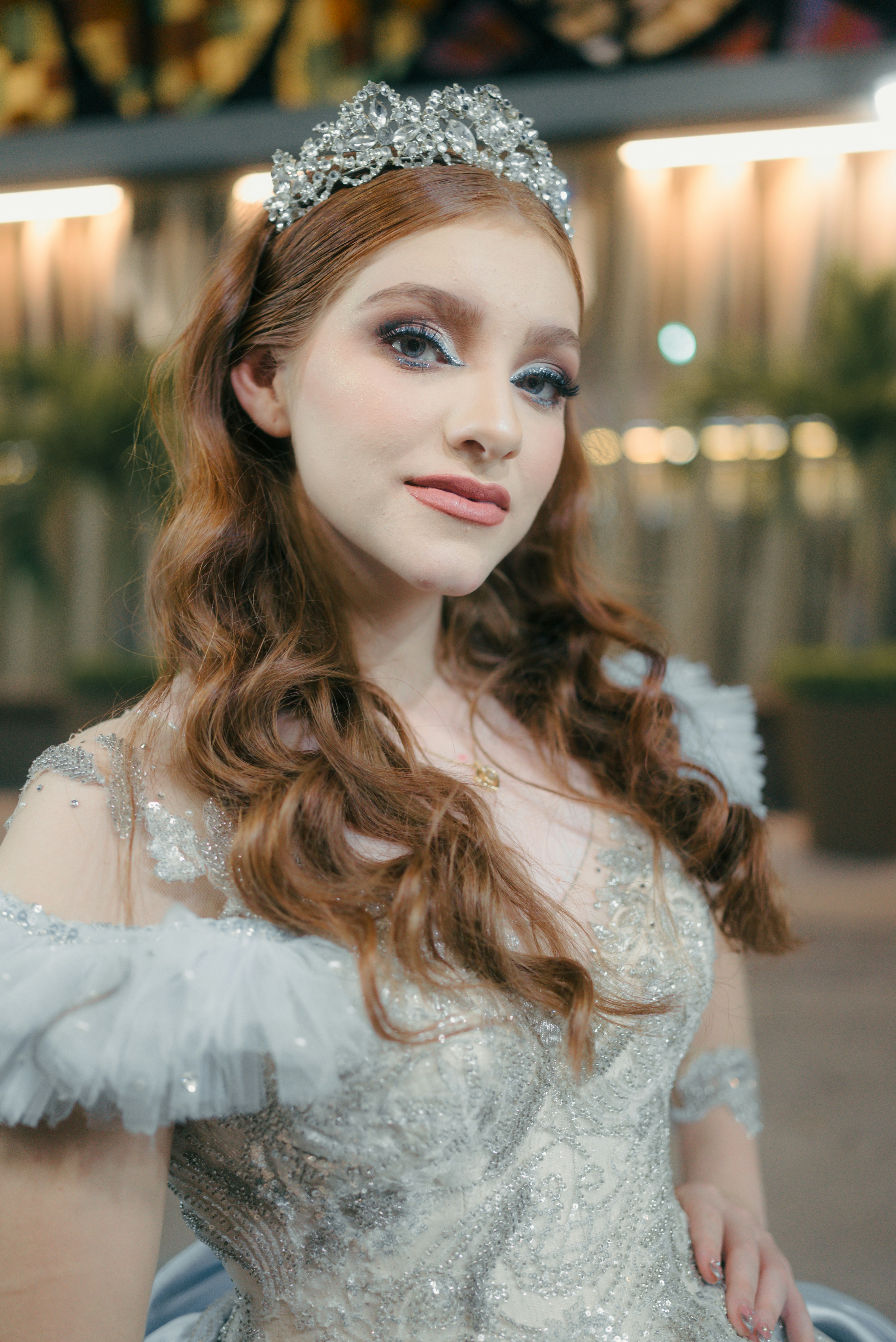 Young woman with tiara and elegant dress