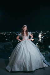 Young woman in a sparkling gown at night