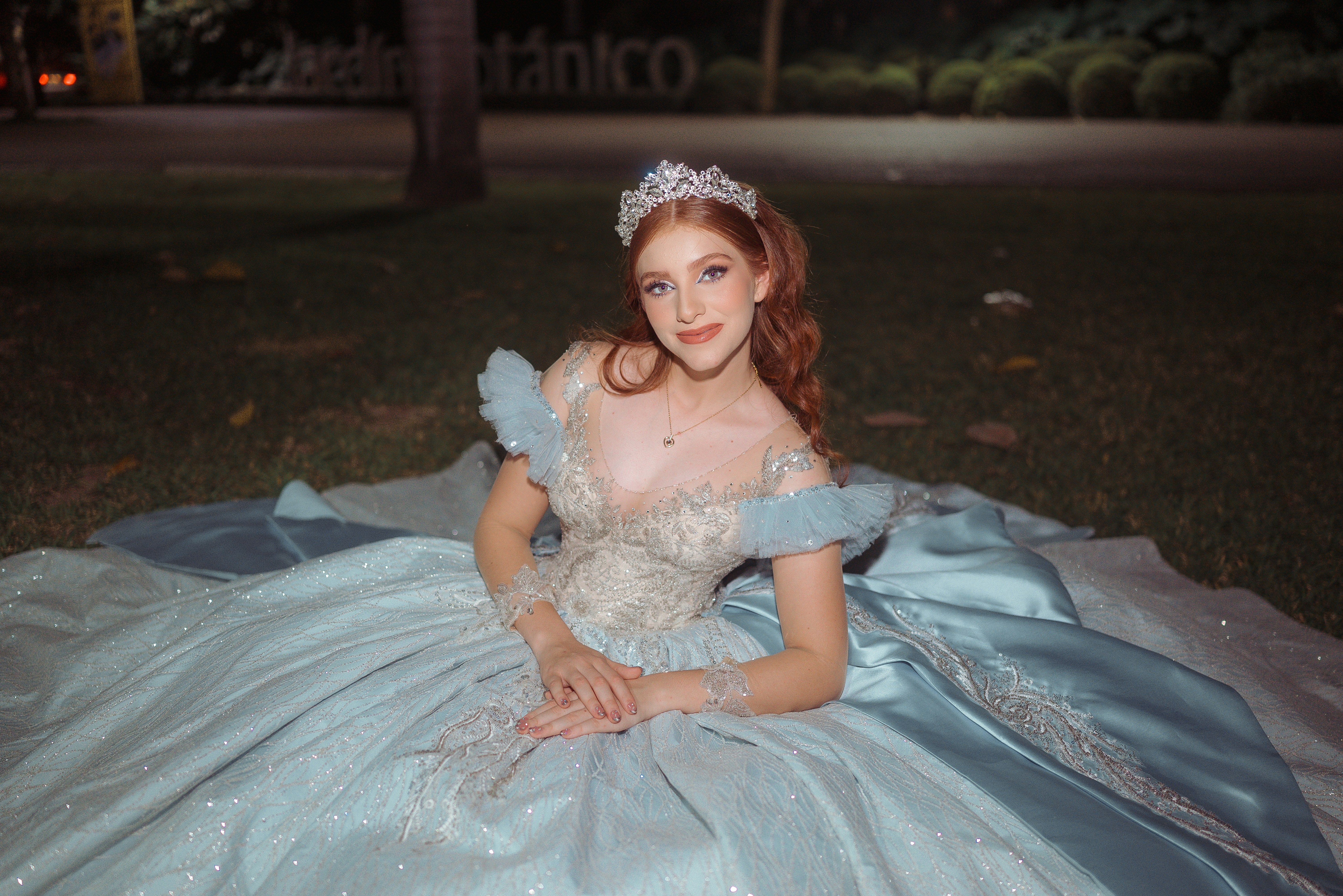 Young woman in a blue princess gown and tiara
