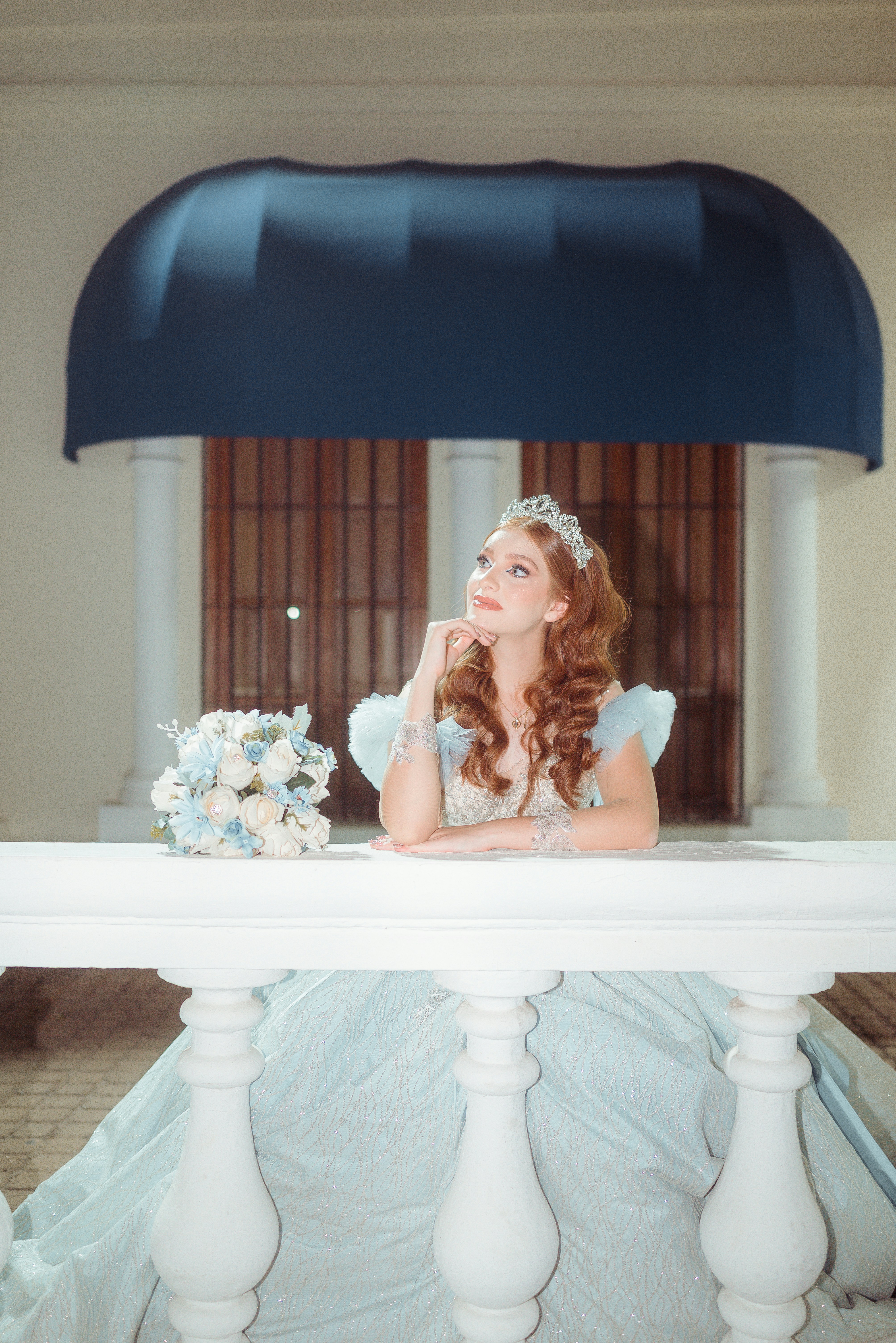Young woman in a tiara with a bouquet