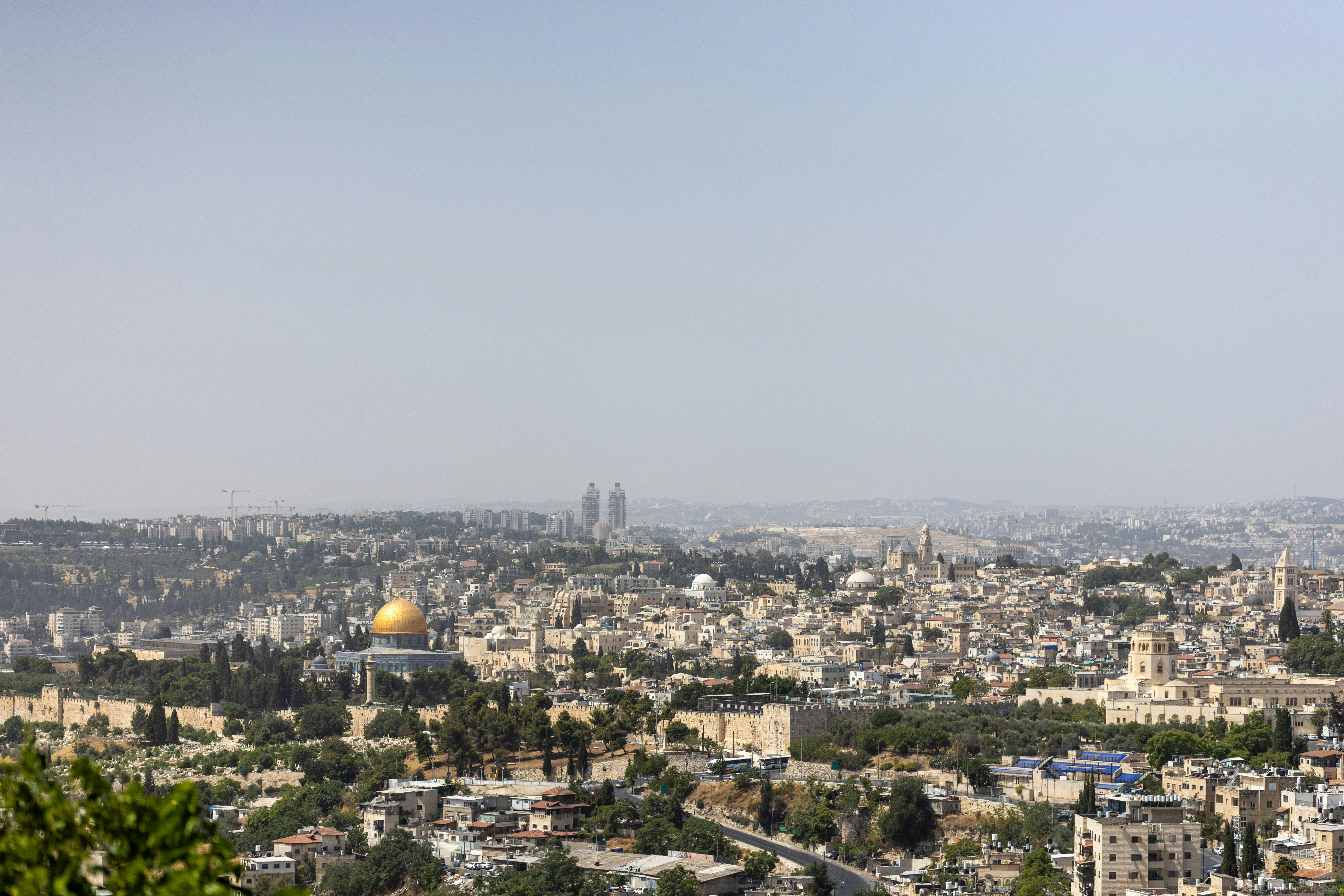Panoramic view of the city of jerusalem with golden dome.