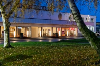 Modern building with large windows at dusk