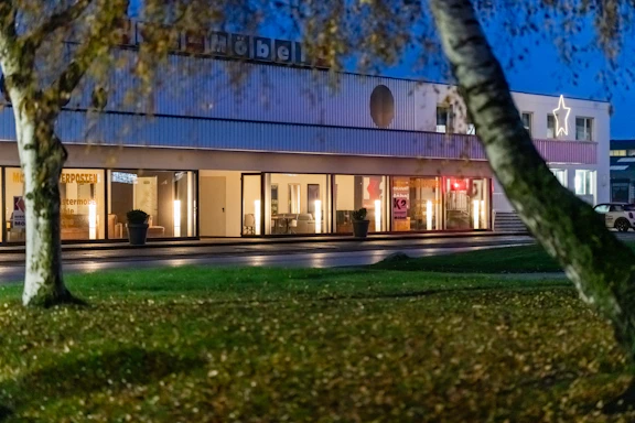 Modern building with large windows at dusk