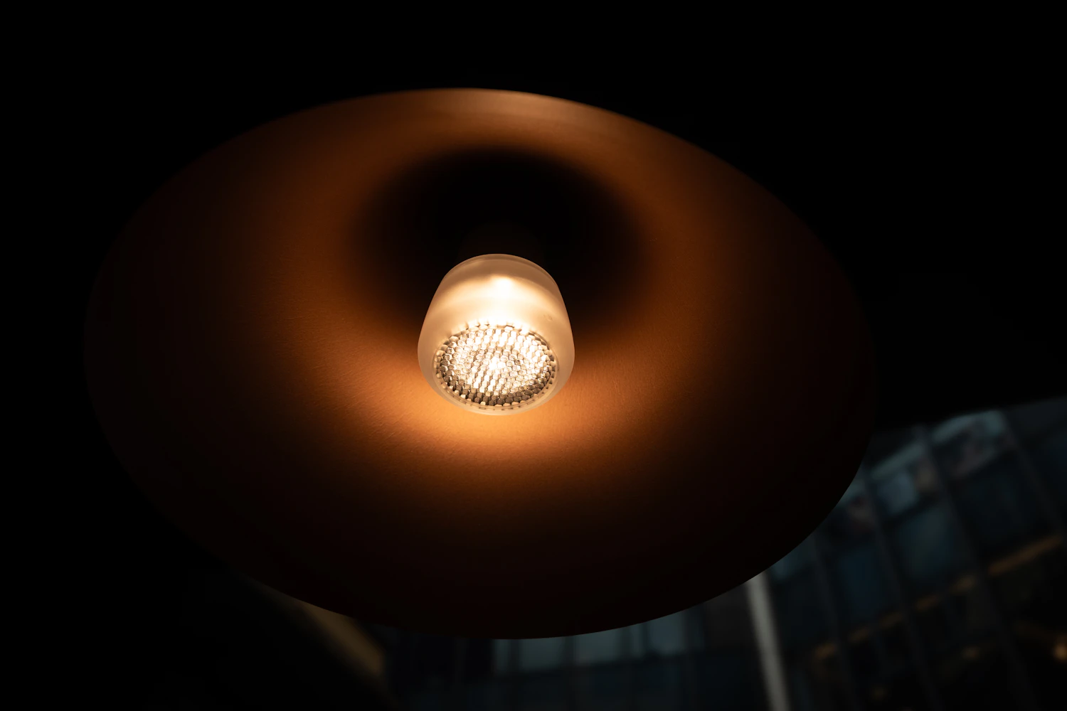 Household globes cast a warm orange light that the eye quickly ignores but the camera records unless white balance corrects it.