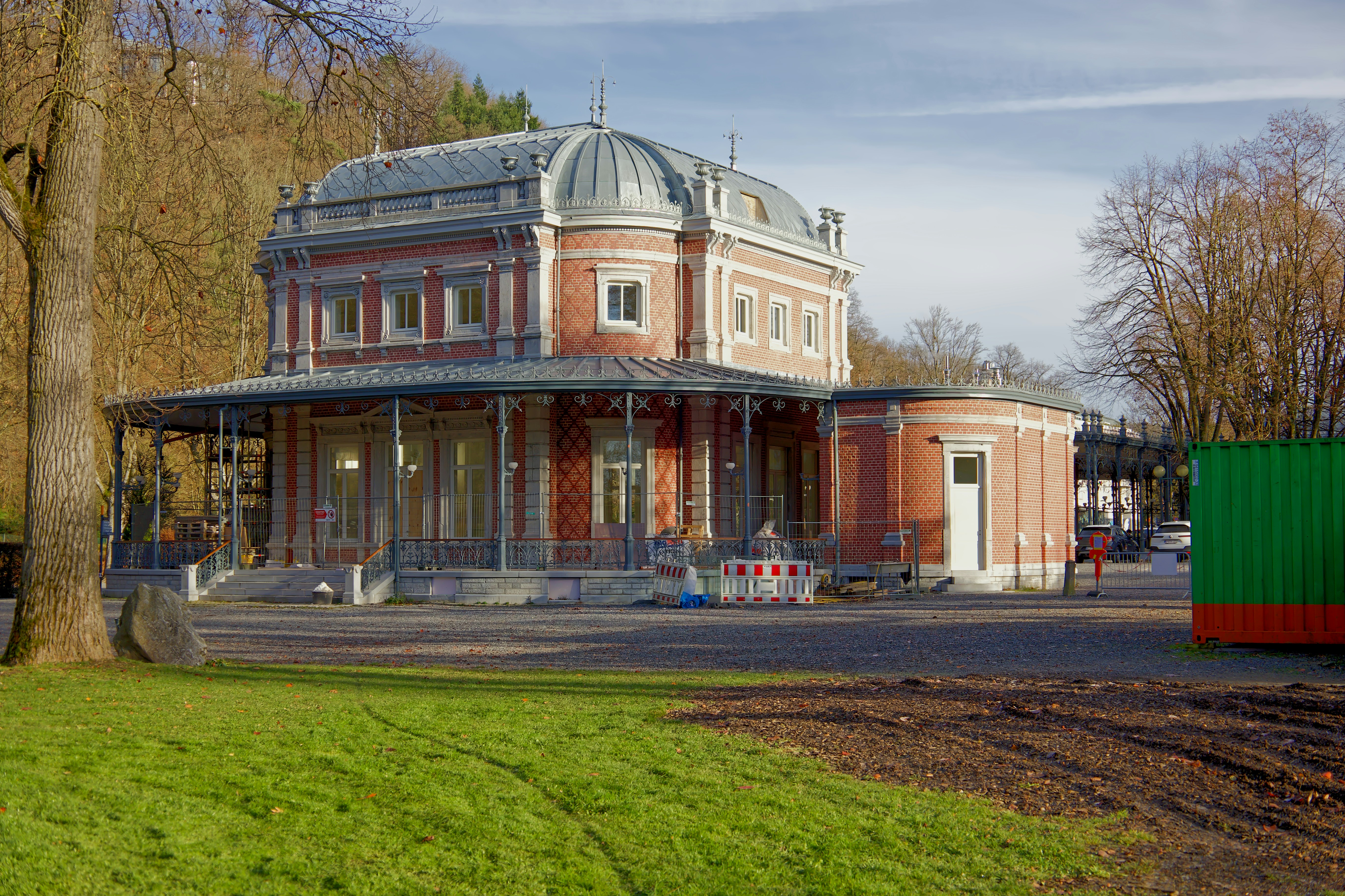 Historic red brick building with a domed roof.