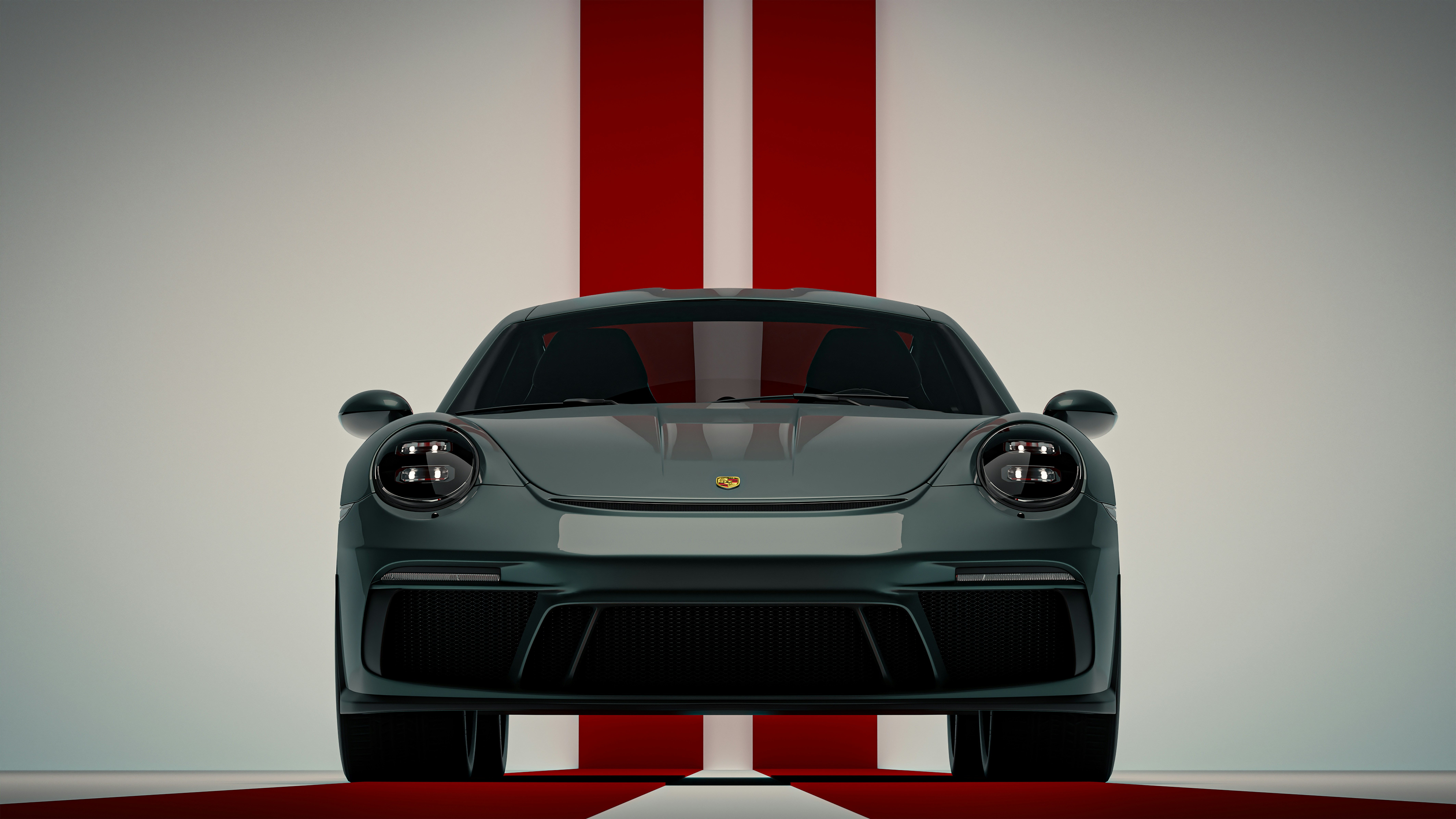 A gray porsche 911 parked on a white background.