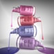 Stack of nail polish bottles with dripping polish