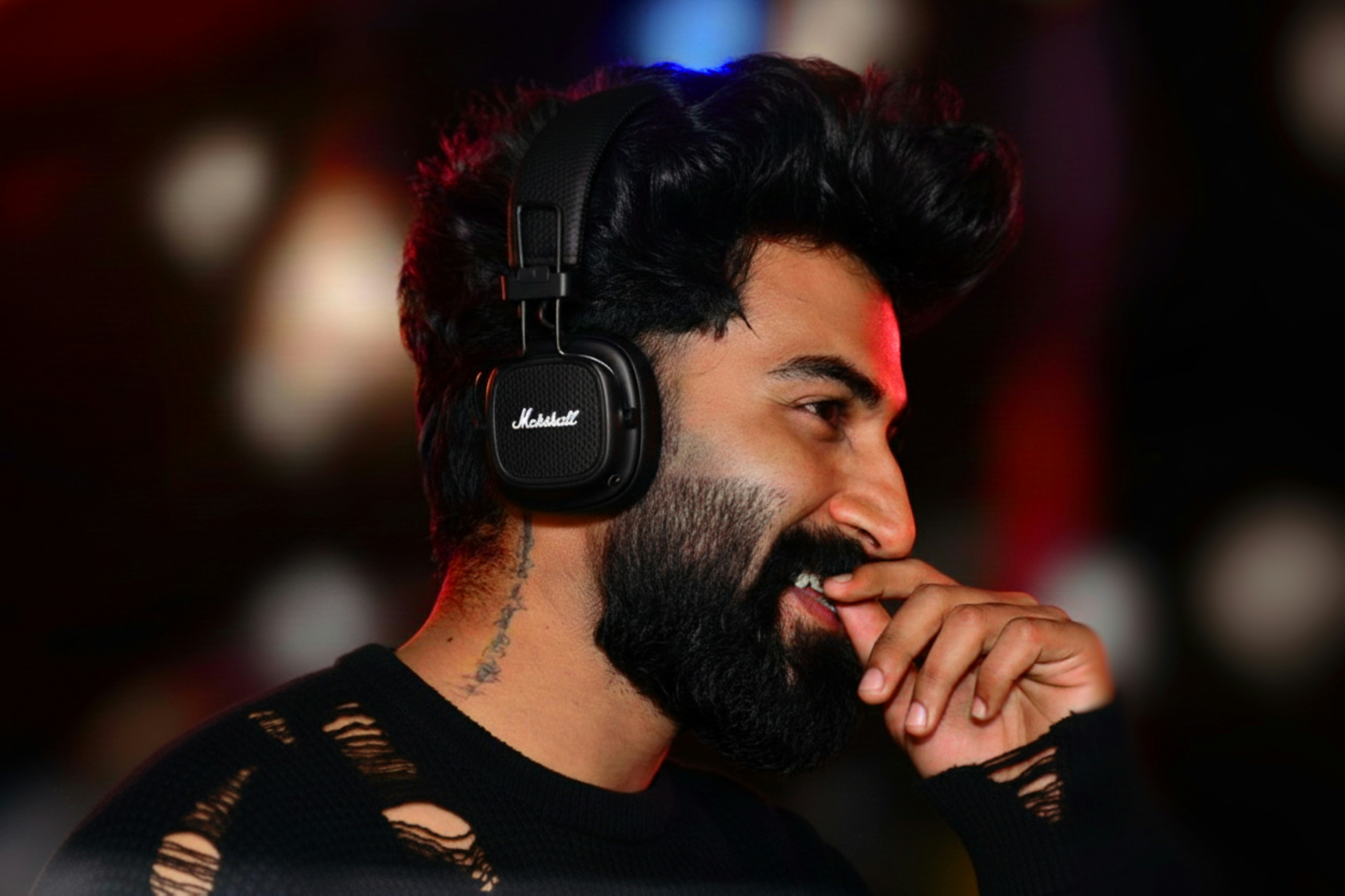 Man wearing headphones and looking away