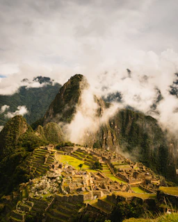 Ancient inca citadel of machu picchu shrouded in mist.