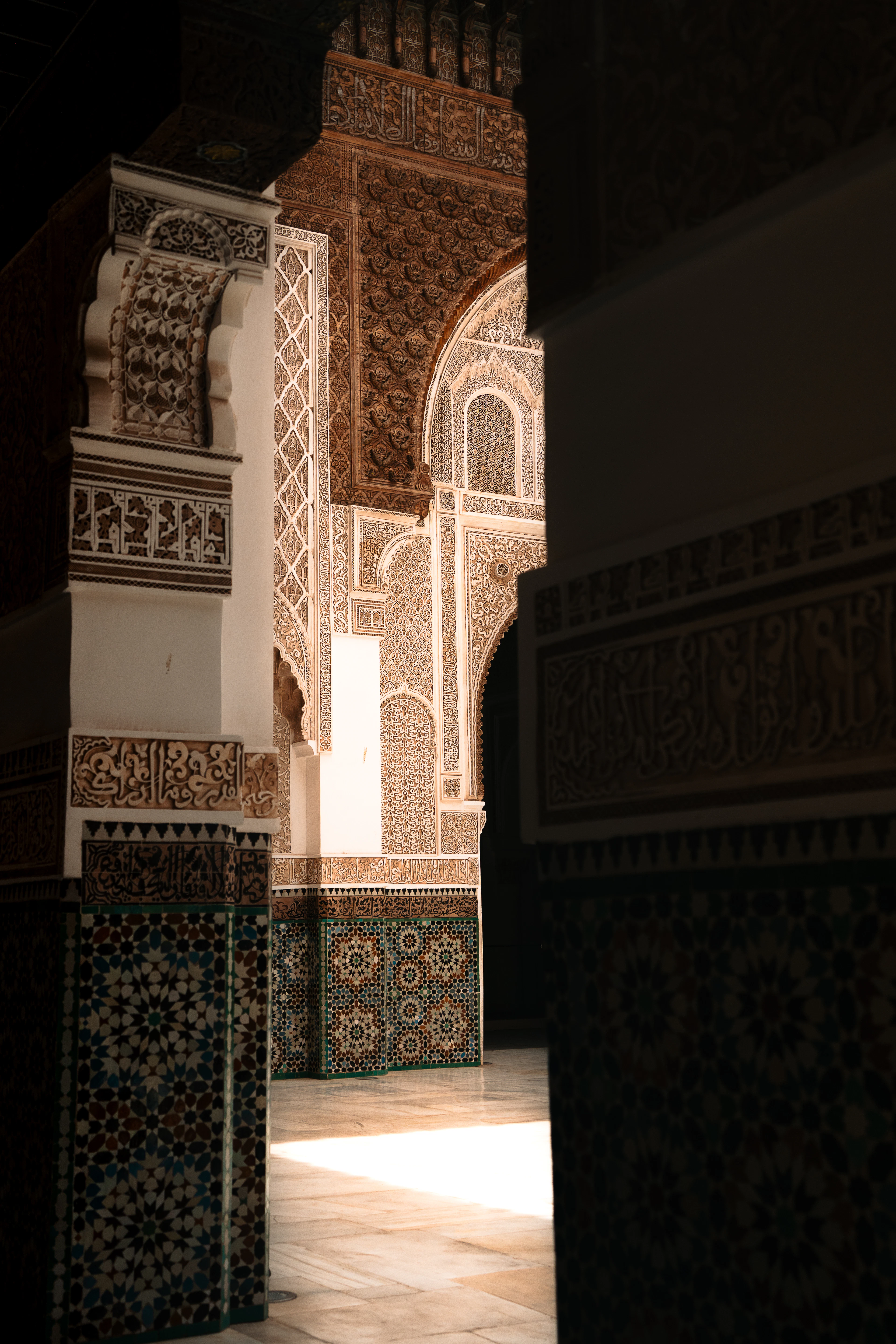 Traditional Moroccan tilework and carved stucco archways