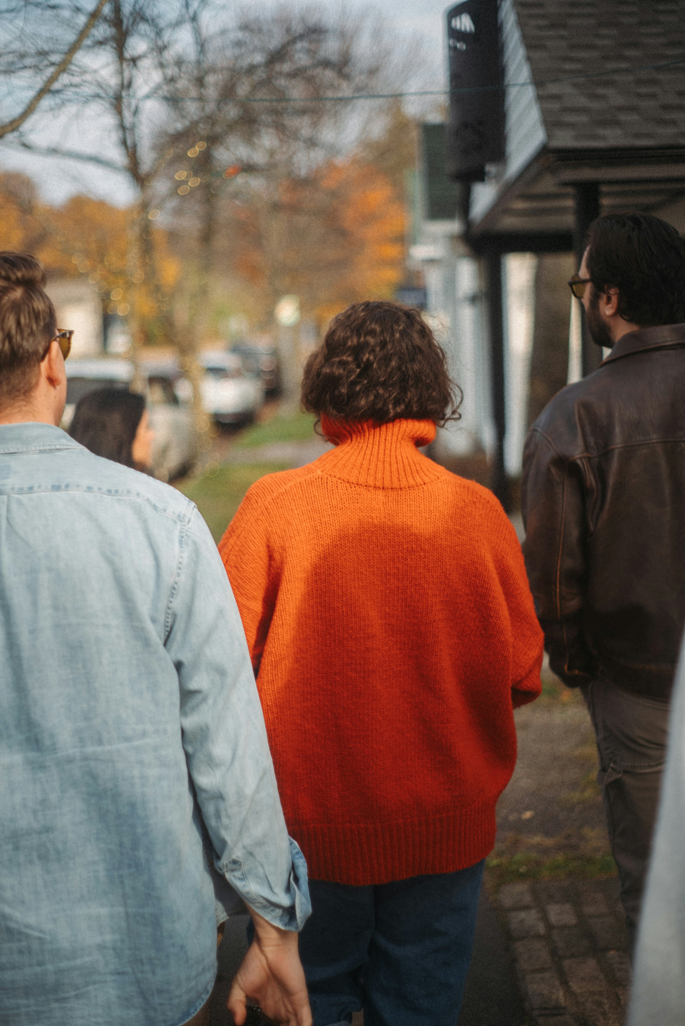 People walking down a suburban street