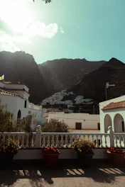 White buildings nestled in a mountain valley.