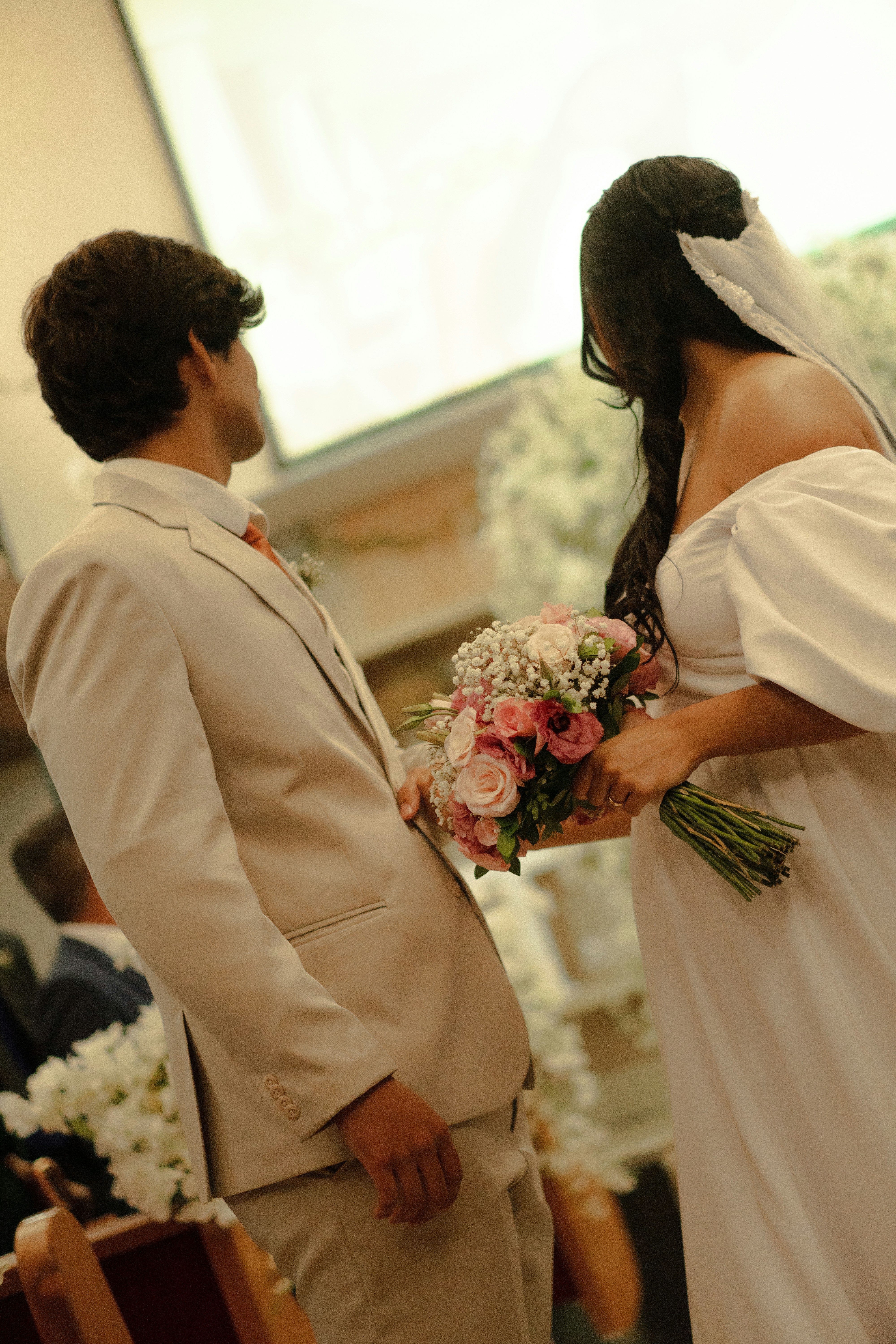 Bride and groom holding a wedding bouquet