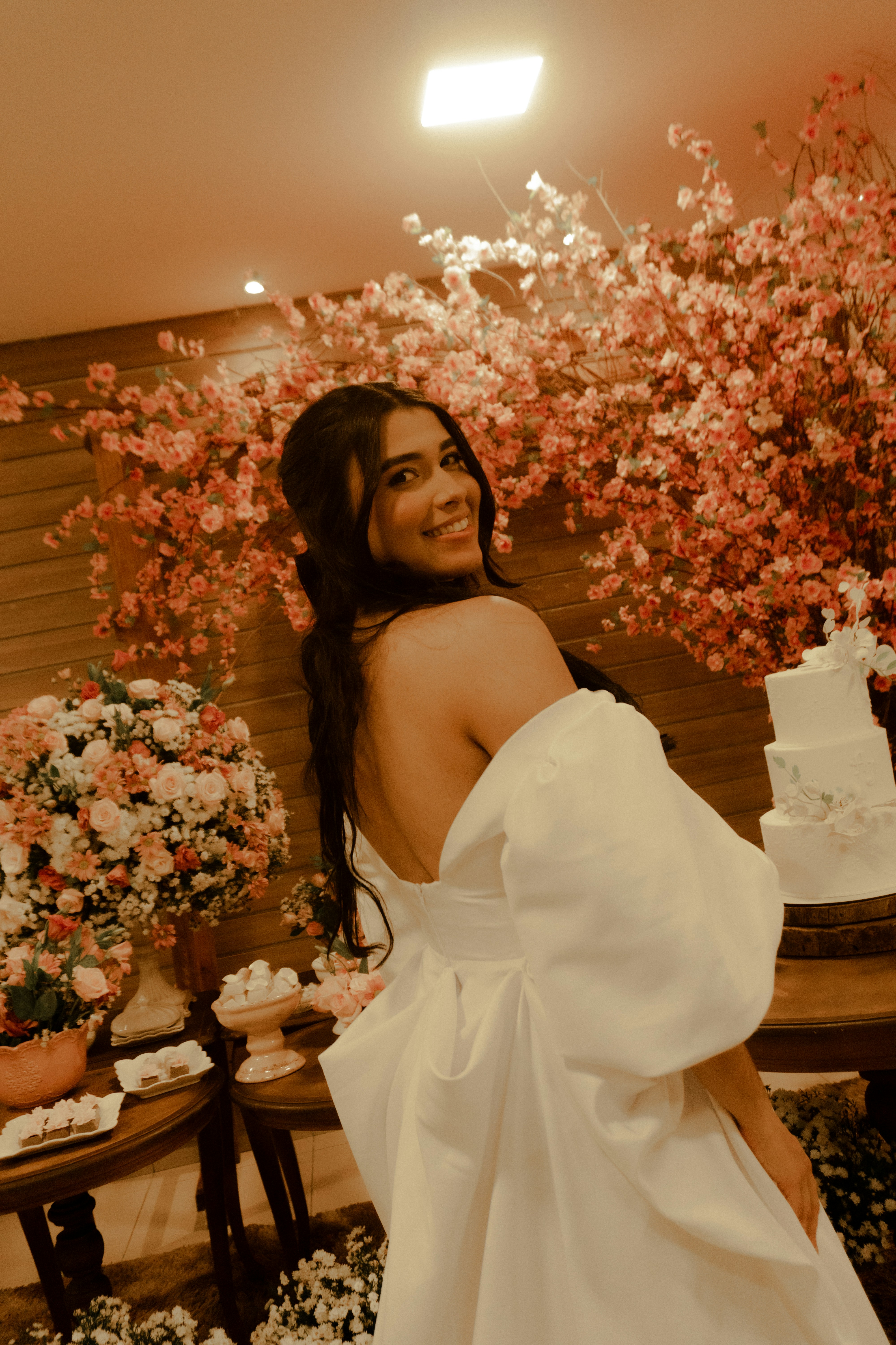 Young woman in white dress with festive decorations