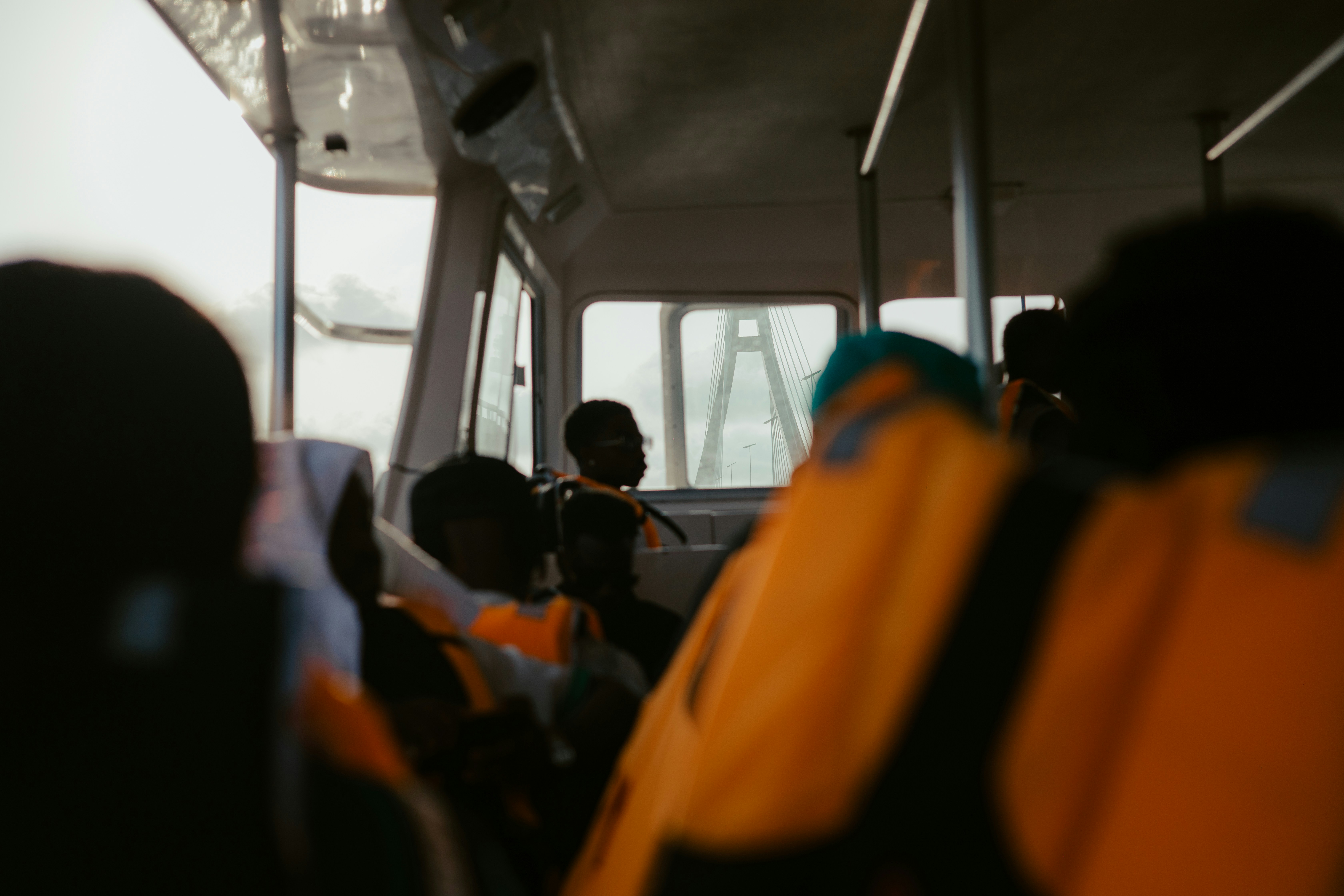 People wearing life jackets on a boat.