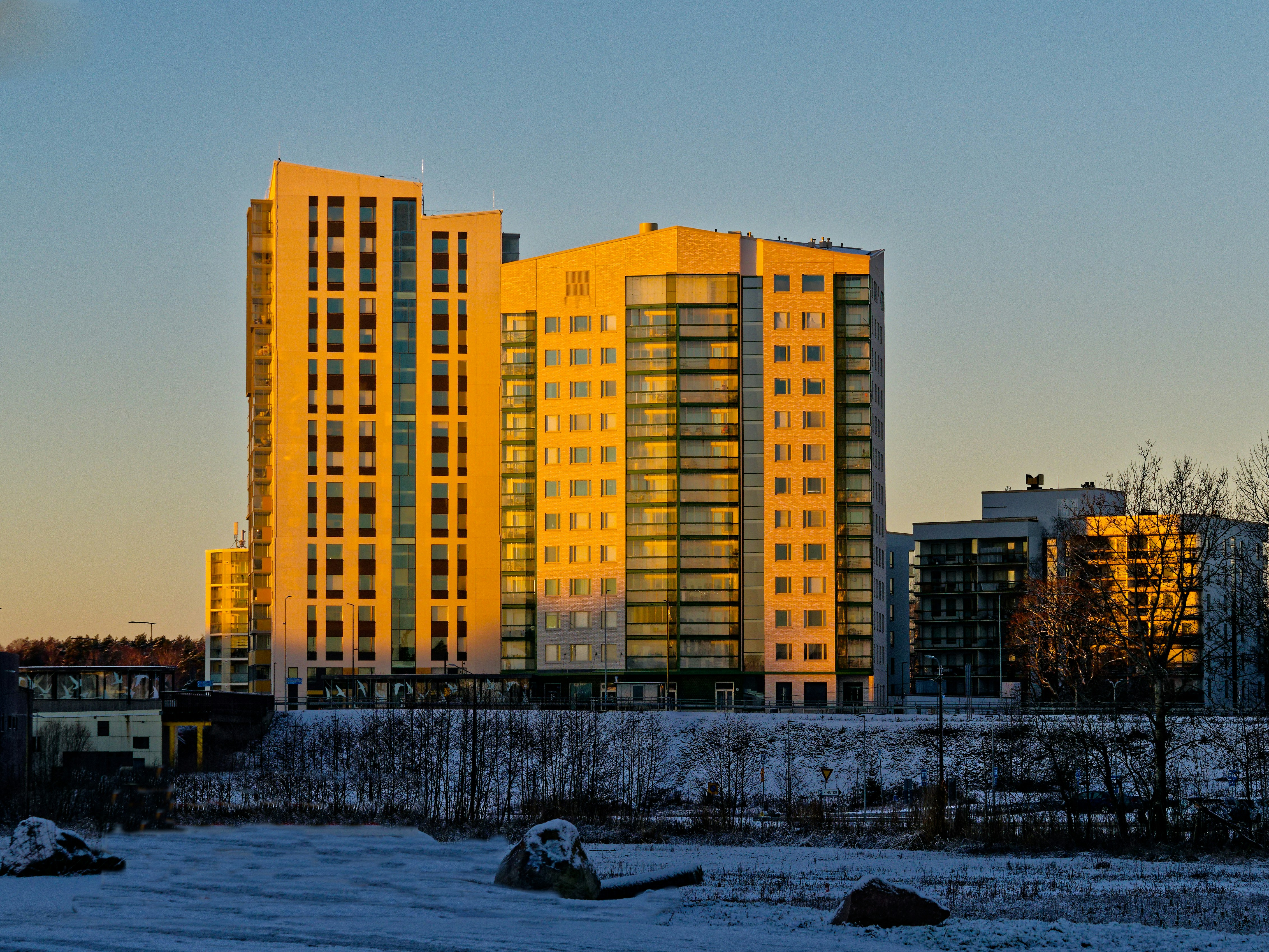 Modern apartment buildings illuminated by golden sunset light