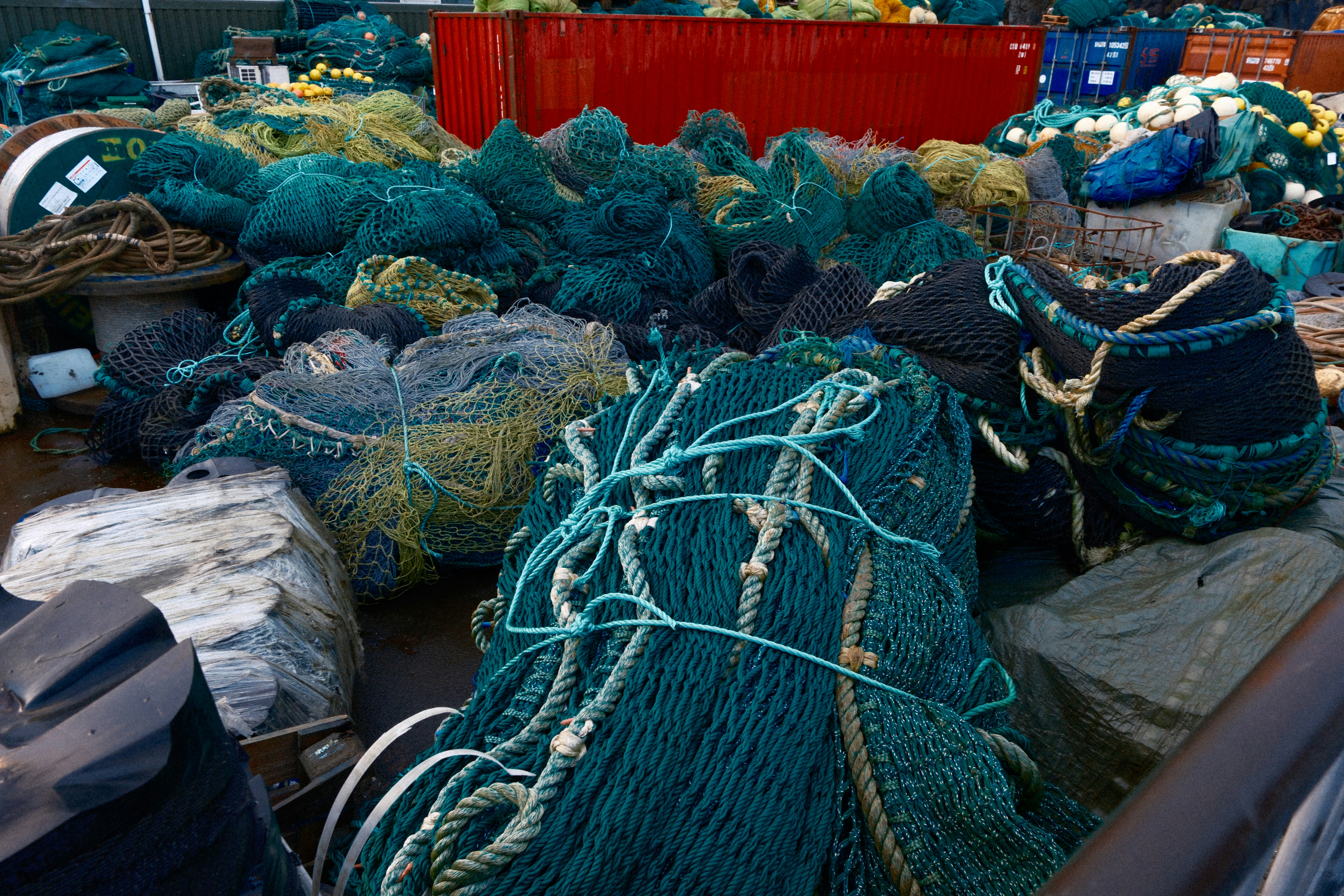Pile of tangled fishing nets on a dock