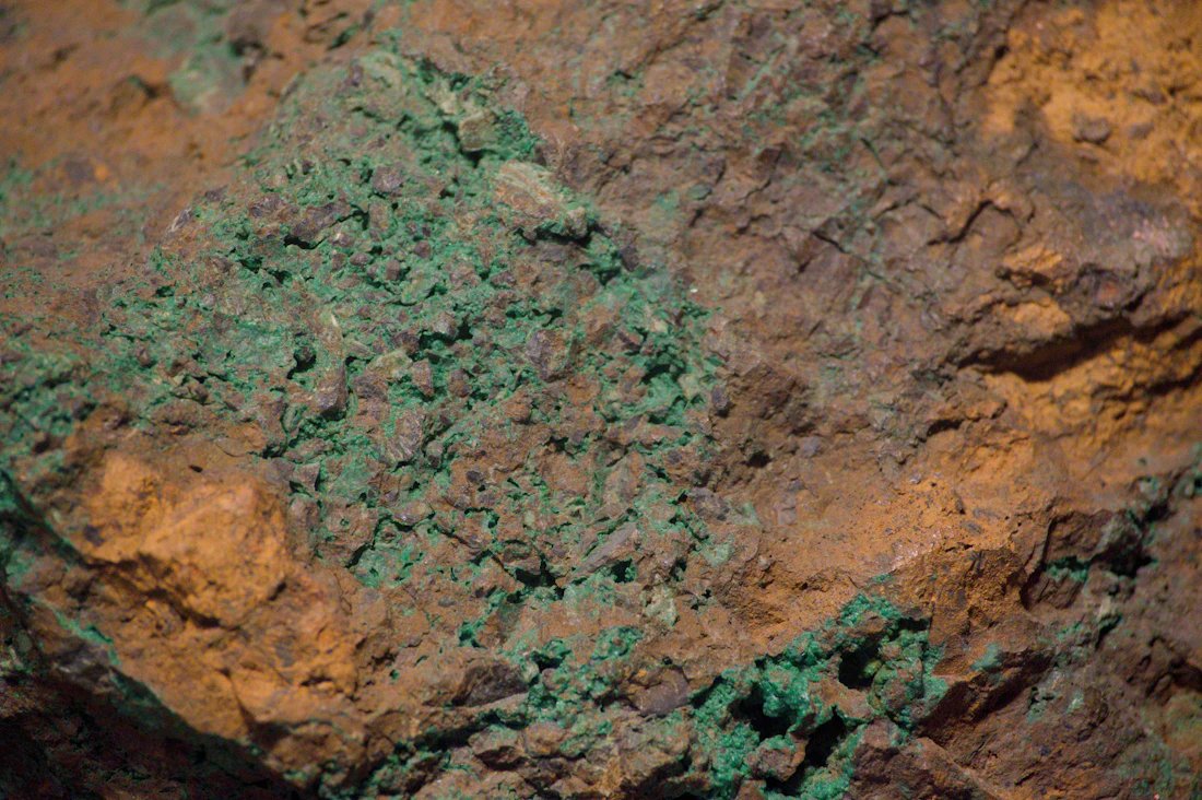 Genuine close-up photograph of copper ore with green mineralisation