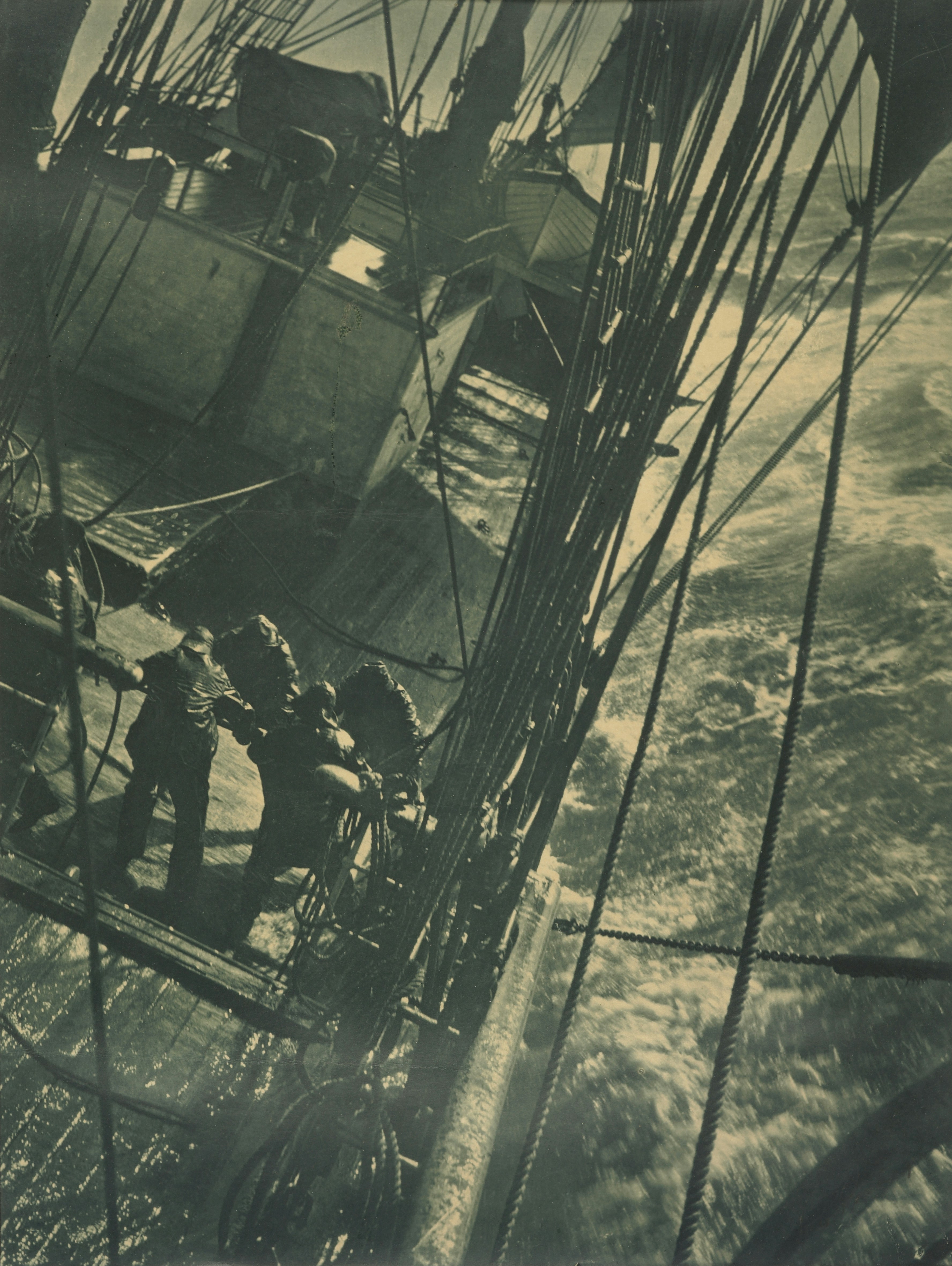 Sailors working on a ship in rough seas