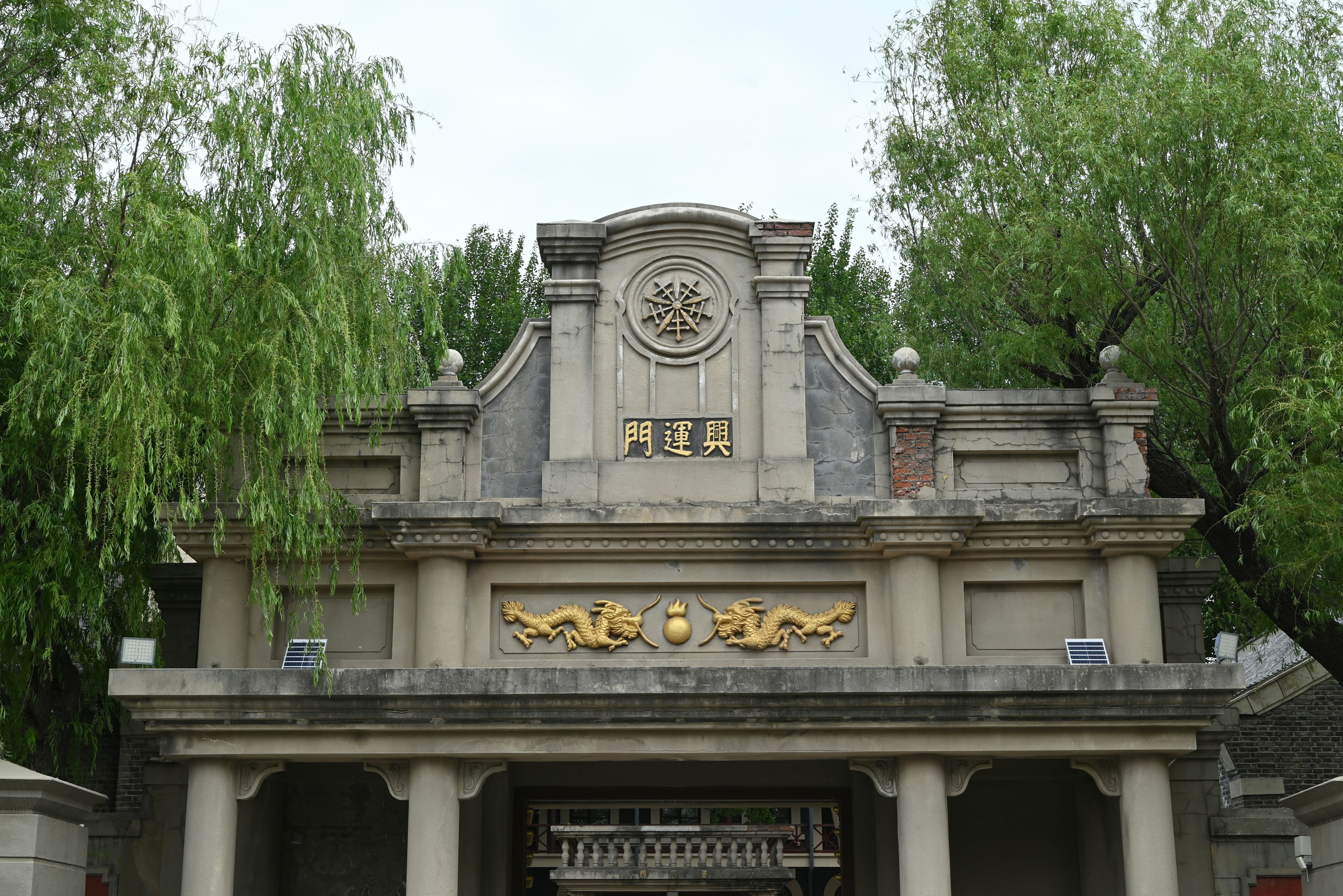 Ornate building facade with golden dragon motifs.