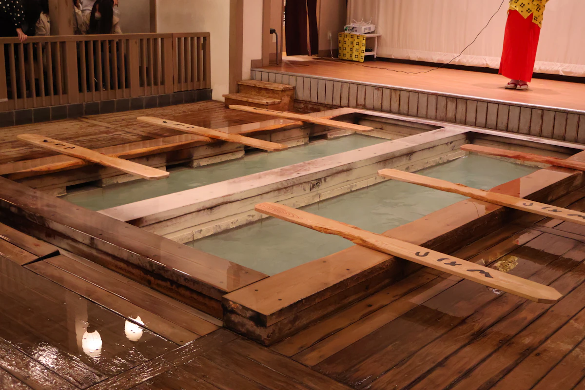 A wooden hot spring bath with slatted walls