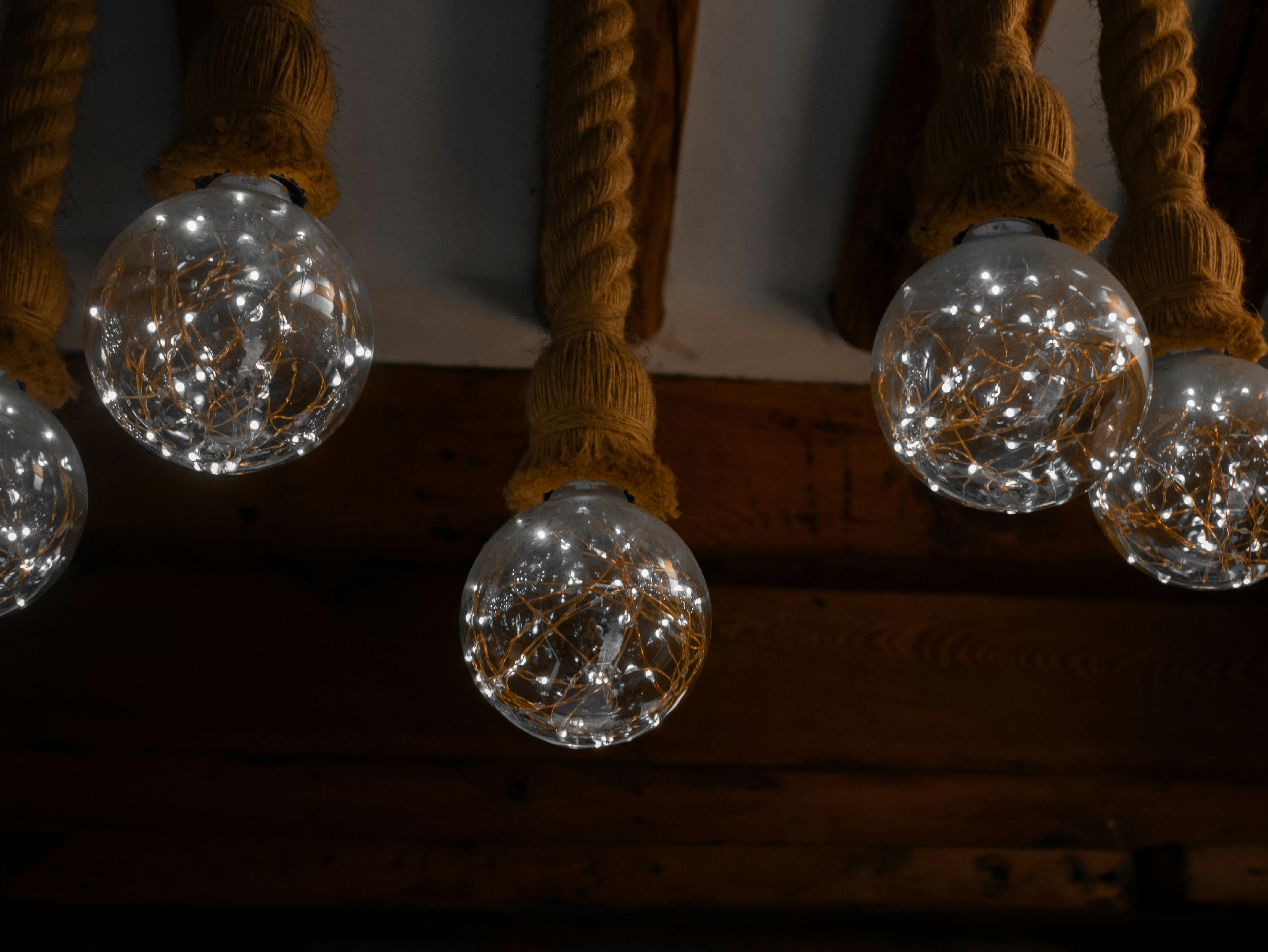 Clear glass bulbs with fairy lights and rope