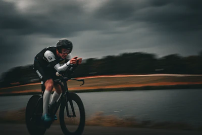 Cyclist racing on a road with blurred background