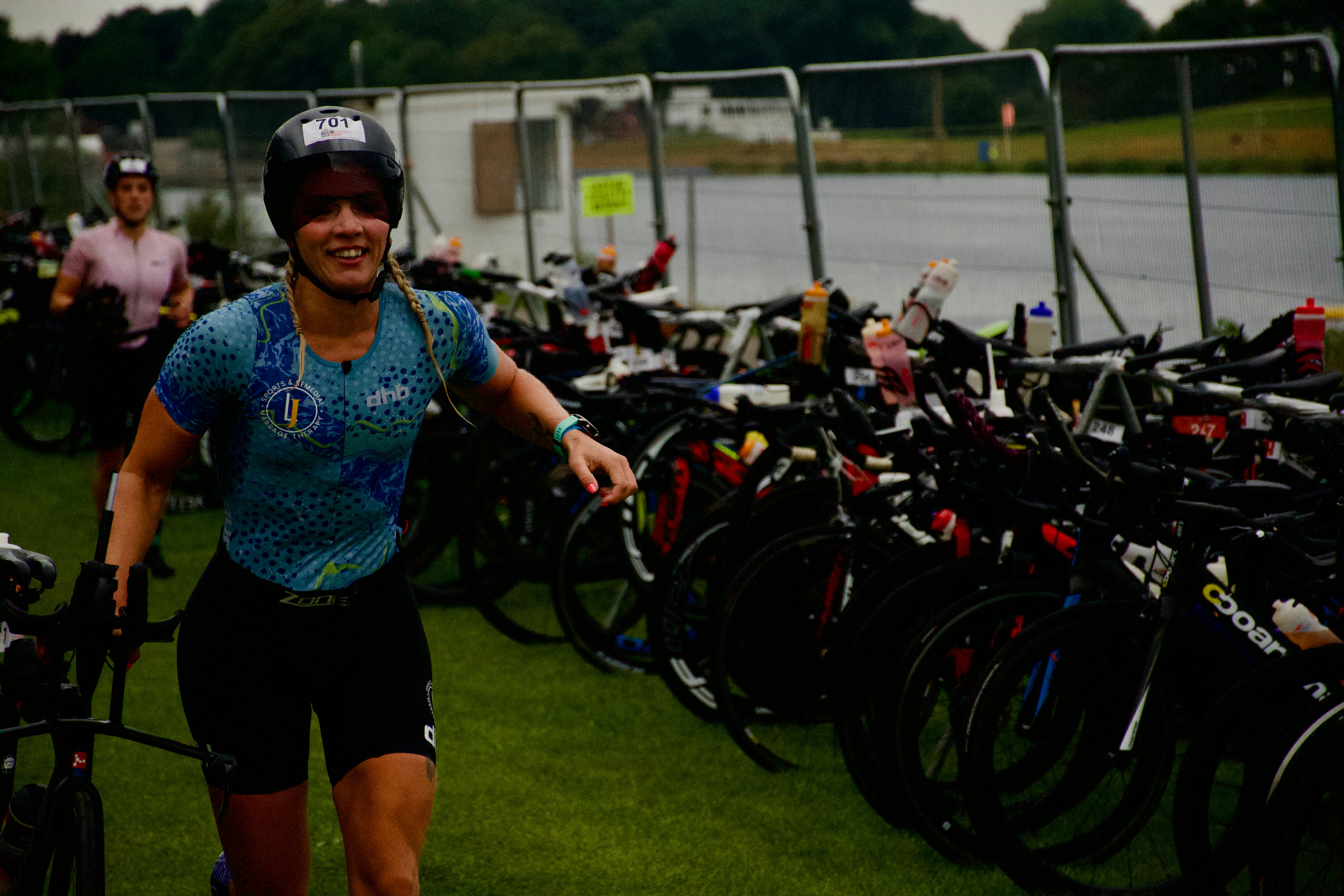 Woman with bicycle at a race transition area
